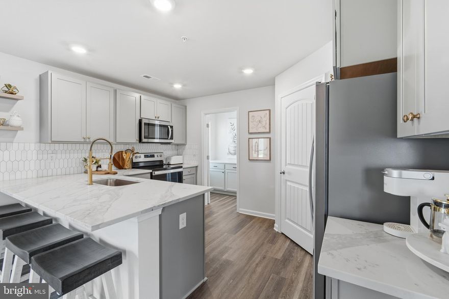 Beautifully done! A MUST see! UPGRADED 2023-built Smart Home, tucked into a quiet and friendly Chestertown community. Thoughtfully enhanced throughout, the kitchen shines with new quartz countertops, a stylish backsplash, upgraded sink and faucet, and added cabinetry with elegant hardware. Fresh light fixtures bring a warm glow to the living spaces, while the laundry room offers added function with quartz surfaces and extra storage. The powder room has been transformed with a stunning vanity and modern fixtures. The second floor offers four spacious bedrooms and two full baths. As a bonus, this property is a smart home, offering comfort and convenience at your fingertips. Just a short drive to multiple marinas in Rock Hall and an easy drive to Philadelphia and Washington, D.C.