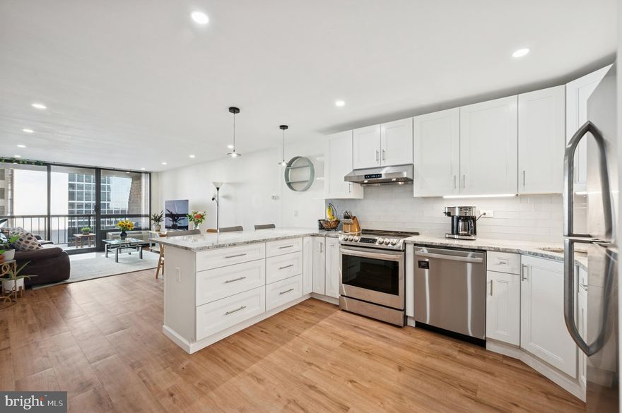 Enjoy convenient city living from this spacious one bedroom, one bath condominium with a private balcony! Thoughtfully and beautifully renovated, this home showcases a graciously proportioned open layout living/dining space with a wall of windows. The open chef's kitchen with breakfast bar is fully-equipped with ample cabinetry, stainless steel dishwasher, range, range hood, refrigerator, and gorgeous stone counters. The bedroom is large enough to include an office nook, and features great storage, including an upgraded walk-in closet. Off the hall, the tiled bath has been updated with a glass enclosed shower and modern vanity. A laundry/utility room by the foyer houses the upgraded washer and dryer and provides additional storage space. Independence Place is an elegant established building with a gorgeous new lobby, 24 hr front desk, fitness center, on-site management, and direct access to a public parking garage (parking subject to availability and an additional monthly fee). Perfectly located on the southeast corner of Washington Square, this home is steps away from the best of Philly's dining and retail scene, world-class museums and historic attractions, and is convenient to public and mass transit, Jefferson University, Pennsylvania Hospital, and more!