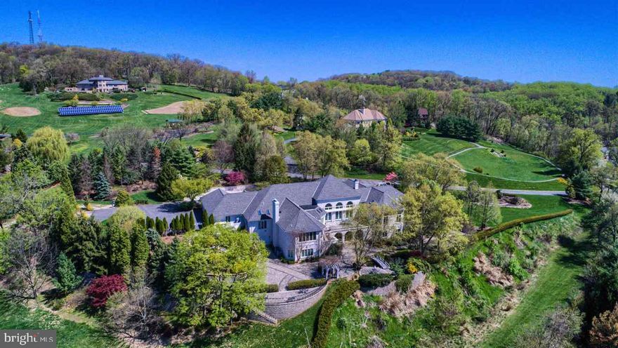 Exquisitely appointed and situated on 3.96 ac of private professionally landscaped gardens.  Gourmet Kitchen w/top-tier appliances opens to FR. Soaring Ceilings, walls of windows, floors in-laid with fossils.  An entertainers delight boasting numerous indoor & outdoor areas for guests.  Fin LL has Rec Rm w/Gas FP, Game Rm, FB w/potential for separate living qtrs w/private entrance.  Incredible views from all levels. Close to everything.