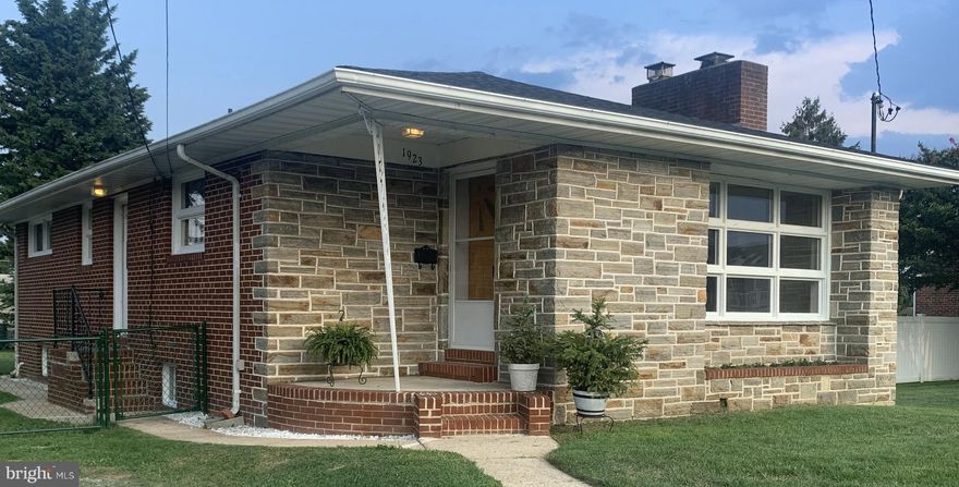 Charming all brick rancher style home. Built in the early 60s by the original owner, the home has stayed in their family til today.  This home has an eye-catching stone front with a built-in flowerbed and plenty of windows that provide lots of sunshine. The large living room has a stone fireplace that mimics the outside stone and newly refinished hardwood floors. This room could easily be used as a living/dining area as well. The spacious eat-in kitchen has plenty of cabinet space with a new electric cooktop and a new dishwasher. The bathroom has been stylishly updated with a new toilet and pedestal sink. All three bedrooms have new carpet and freshly painted walls. On the lower level is a large spacious basement with a washer and dryer that leads outside to a fenced yard with a shed. Recently, the roof and HVAC system were replaced and this home also has an oil furnace backup system for the cold winter temperatures. Dundalk Farms is considered one of the most desirable areas in Dunalk and is conveniently located near shopping, restaurants, and the CCBC campus.