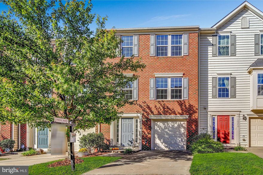 Gorgeous and exquisitely well-cared for one car garage townhome features a large living room area filled with refreshing natural light! The kitchen offers generous size 42" cabinets, along with an island for extra counter space and GAS COOKING! The breakfast area walks out to a spacious, maintenance free, trex deck from the kitchen providing endless possibilities for outdoor enjoyment. Spacious master bedroom suite flooded with sunlight with master bathroom double vanity. Enjoy the lower level with a finished rec room, laundry and a walk out rear entrance to a nice size fenced in yard in addition to garage access in the front. You ll love the abundant neighborhood parking spots for guests! High efficiency HVAC for lower energy bills. Convenient to restaurants, shops and the VRE!