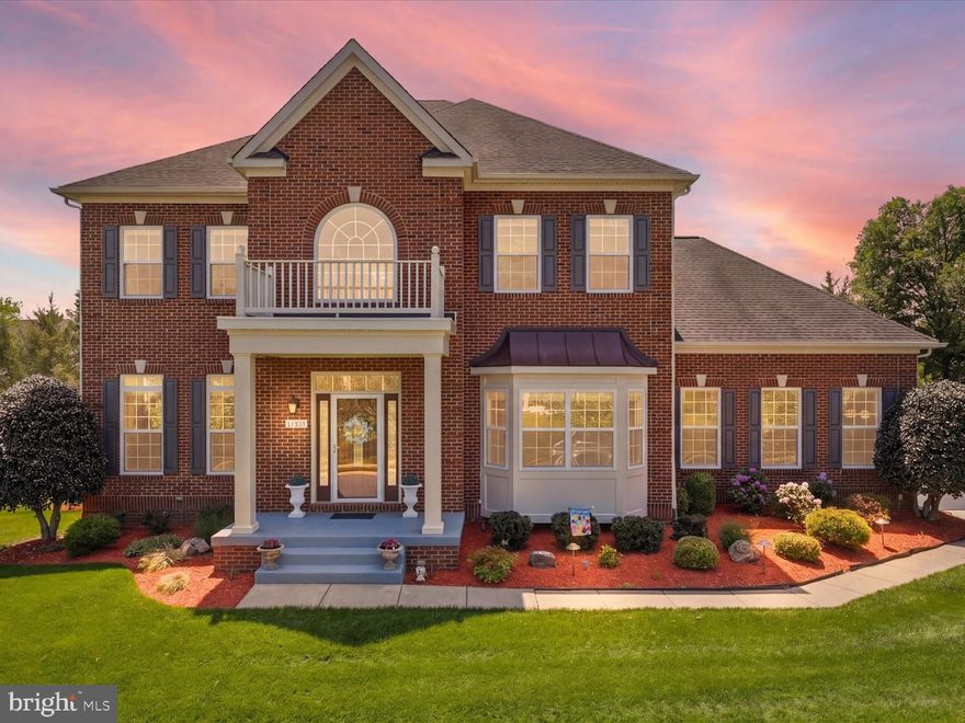 Welcome to Ashburn/Brambleton's most sought-after finds where space, privacy, and everyday living come together effortlessly. Meticulously maintained and thoughtfully updated for comfort and security, this 4- bedroom, plus office/bedroom, and 2 bonus rooms with 4.5 baths and 3-car garage exudes tranquil serenity. Set on an oversized, premium 0.39-acre lot and backs into trees and a creek. As you enter this gorgeous home, you are greeted with a large foyer and vaulted ceilings where you see both dining and formal living rooms. Admire the curved staircase leading to primary and secondary bedrooms. Inside, the layout is both functional and inviting with generous living spaces and 10-ft ceilings throughout this beautiful home. Upstairs, the spacious owner's suite and sitting room is separated by a dual-sided gas fireplace creating a relaxing retreat, his and hers walk-in closets, spacious bath, and a soaking tub. Across from the owner's suite are Jack and Jill bedrooms with adjoining bath, laundry rm with LG washer/dryer and utility sink, and a guest en-suite bedroom at the end of the hallway (perfect for guests or in-laws).

On the main level, enjoy the beautiful chef's kitchen with an open layout to the family room where everyone can spread out comfortably. At the heart of the home, the spacious island kitchen features granite counters, stainless steel appliances, gas stove, breakfast bar, breakfast room with a bay window, and ample cabinet space including the large walk-in pantry, and glass mosaic tile backsplash. Perfect for everyday living and entertaining as it includes a butler's pantry with mini fridge and dishwasher that connects the kitchen and formal dining room creating a seamless flow. Adore the cozy family room with gas fireplace, pre-wired for surround sound system, and built-in bookshelves. Step out to the covered screened-in porch/deck and enjoy nature. Next to the kitchen is the huge mudroom that leads to the expansive side load 3-car garage, which has plenty of wall-mounted storage shelves and 2 bike pulleys to store bikes above ground.

Lower-level walk-out finished basements open floor plan also designed for comfort and entertainment. Two bonus rooms can easily be converted to bedrooms/gym/office, plus full bath. Equipped with wet bar granite countertop/backsplash and mini fridge. Large open area with optional living room space and recreation room. Huge storage room with built-in shelves. Enjoy the best feature of the basement, a theater room carefully designed by the owner. Fully loaded with 8-person theater reclining seats with tray tables, 11.2 surround sound system, 4K JVC projector, and 131-inch screen!!! Head out to the private backyard with a covered stamped concrete patio. Gather family and friends around the fire pit or enjoy backyard games and entertainment. Fully fenced backyard. This home is truly a gem. Located nearby top-rated schools, golf course, town center, parks and recreation, silver line metro station, wineries, and much more.

Home upgrades for added peace of mind includes 2026 upper-level HVAC with 10-year warranty, full house humidifier, freshly painted, hardwood floors throughout, upstairs bedrooms with gorgeous hand-scraped natural hickory hardwood floors, crown molding, shadow boxes, finished basement, deck with screened-in porch, irrigation system, and professional landscape lighting; offering seller paid home warranty. **Wallbox Pulsar plus level 2 EV charger**