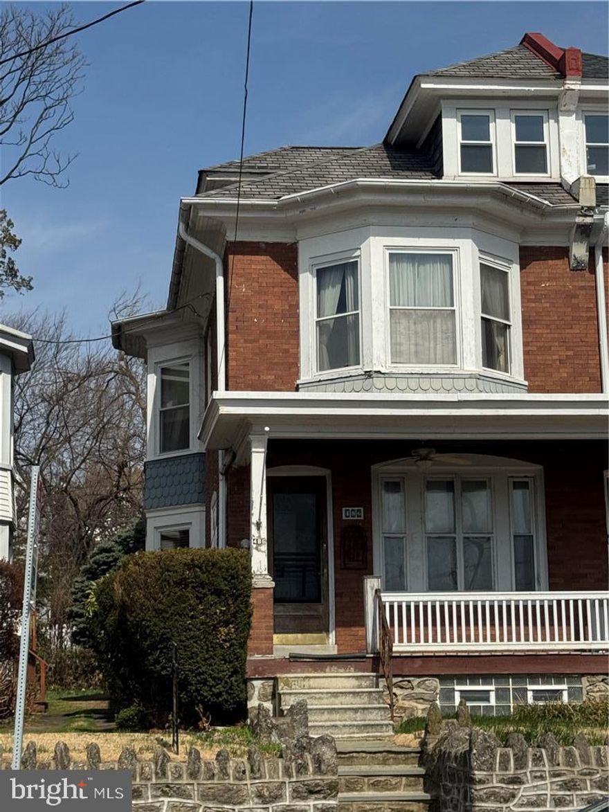Historic character home with Renovation Potential near Manayunk Welcome to 486 Roxborough Avenue, a remarkable early-20th-century Colonial Revival brick twin with with Victorian influence that blends timeless Philadelphia craftsmanship, generous living space, and unbeatable proximity to Manayunk’s vibrant Main Street. Set behind a classic stone retaining wall and elevated above the street, this stately home immediately impresses with its wide covered front porch, distinctive bay windows, and handsome brick façade — a design rarely found in modern construction. Inside, the home showcases the rich character of historic Philadelphia architecture. Beautiful original woodwork, detailed moldings, hardwood floors, and decorative millwork flow throughout the home, preserving the craftsmanship of its era. The main level offers a traditional yet spacious layout with large sun-filled rooms and striking architectural details. A charming bay window fills the living area with natural light while overlooking the neighborhood and park across the street. The kitchen provides generous space for cooking and gathering and offers excellent potential for customization. Upstairs, you’ll find well-proportioned bedrooms, abundant closet space including a walk-in dressing room, and a full bathroom featuring classic fixtures and vintage charm. A third-floor level adds valuable flexible space — possibility for additional bedrooms, a home office, studio, or future primary suite. The home also features a large full basement with laundry and mechanical systems, offering exceptional storage and workspace. Major systems include: • Crown gas boiler heating system (2013) • Bradford White hot water heater (2018) • Gas utilities and radiator hot water/steam heat throughout the home Outside, enjoy the welcoming front porch and the convenience of city living with neighborhood green space directly across the street. Perhaps the home’s most compelling feature is its exceptional location. Situated just minutes from Manayunk’s iconic Main Street, residents enjoy easy access to: • award-winning restaurants • cafes and boutiques • nightlife and entertainment • SEPTA regional rail and transit • the Schuylkill River Trail • local parks and recreation Homes with this level of architectural character, generous space, and walkable access to Manayunk rarely become available. This property presents a unique opportunity for a buyer to restore, renovate, or simply enjoy a true Philadelphia classic in one of the city’s most beloved neighborhoods. Key Property Highlights • Classic brick twin architecture • Wide covered front porch • Beautiful bay windows • Original hardwood floors • Detailed historic woodwork and trim • Walk-in closet / dressing room • Third floor additional living space • Radiator heating throughout • Large basement with laundry • 2018 Bradford White hot water heater • 2013 Crown boiler heating system • Park directly across the street • Minutes to Manayunk Main Street Location Highlights •  5 minutes to Manayunk Main Street • close to SEPTA regional rail • near Schuylkill River Trail • convenient to Center City Philadelphia • surrounded by neighborhood parks and green space