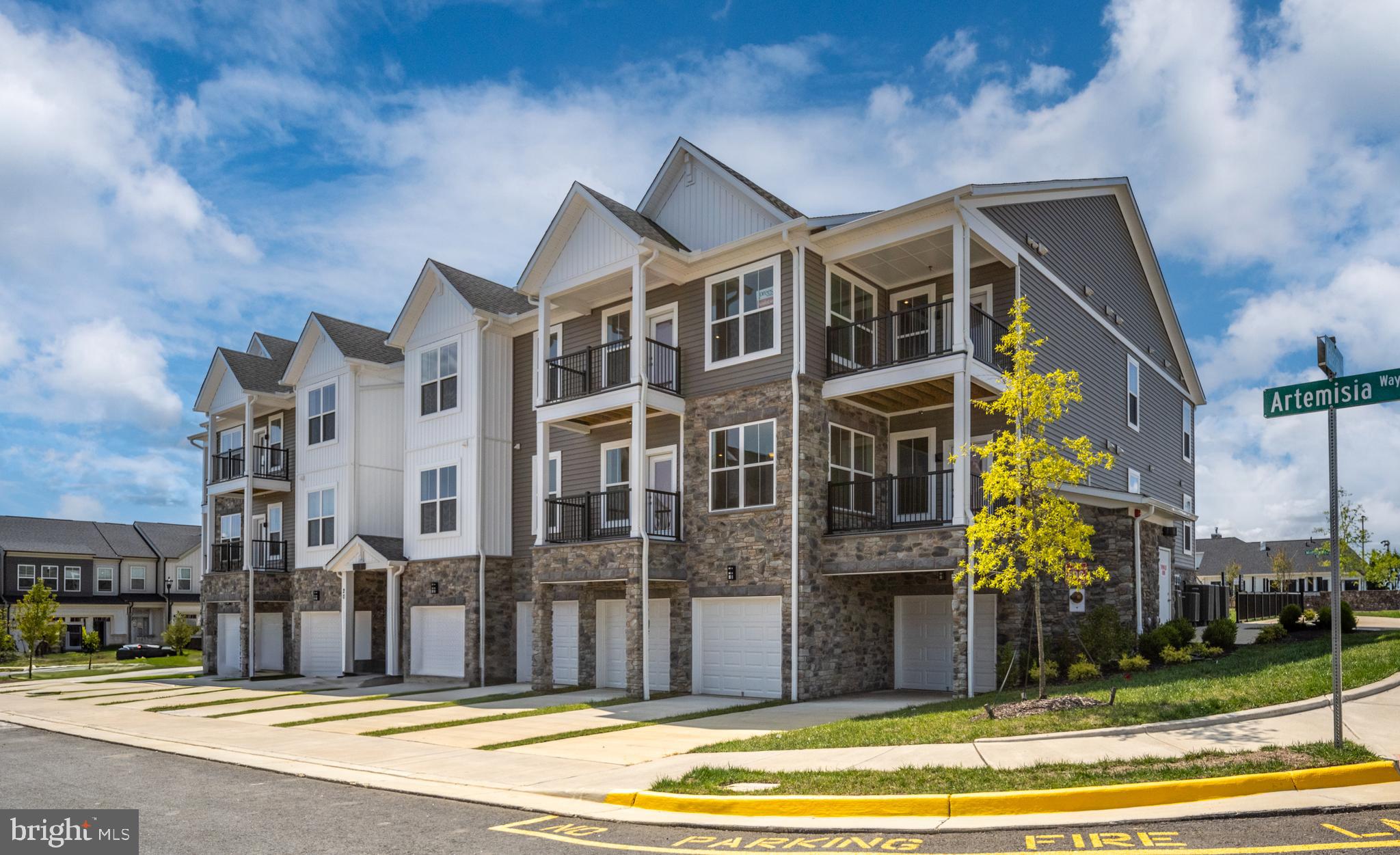 Welcome to this stunning one level condo in the desirable Embrey Mill community, offering a blend of elegance and functionality. Private and secure building with smart video intercom access, a covered front entrance, and individual entry points for each unit. The property boasts private garage access and driveway. Inside, you'll be greeted by a spacious, furnished 2-story atrium foyer with a tray ceiling detail and a coat closet. This leads to an open and airy living space that includes a large, well-equipped kitchen with an oversized island, perfect for meal preparation or entertaining guests. The family room is bathed in natural light, with high ceilings and large windows, and opens to a spacious balcony complete with a hose bib for gardening. The upgraded kitchen features premium Whirlpool stainless steel appliances, granite countertops, a designer tile backsplash, pull-out shelves, and a large walk-in pantry. The oversized primary suite offers a luxurious retreat with a super walk-in closet, and the primary bath boasts a double vanity, ceramic tile, and an upgraded frameless glass shower. Two additional bedrooms with spacious closets provide ample space for guests, home offices, or additional retreats. Additional features include a pocket office, a large laundry room, luxury vinyl plank flooring, and DreeSmart technology for seamless home automation. Enjoy an active lifestyle with a convenient staircase for easy outdoor access, secure building design, and included fire suppression for added safety.
The Embrey Mill community is ideally located just minutes from I-95 and Route 1, nestled between the vibrant shopping hubs of Garrisonville Road and Embrey Mill Town Center. Here, you’ll find the newest Publix grocery store and plenty of shopping and dining options. Enjoy resort-style living with exclusive amenities, including a clubhouse for active adults featuring a game room, private fitness center, yoga room, and more. Outdoor enthusiasts will love the private pickleball and bocce courts, plus a patio with fire pits, gas grills, and large chess sets for entertainment. The community also has an on-site activities director to keep you engaged with fun and exciting events throughout the year.
****All interior photos are for illustrative purposes only and not actual home. Interior selections may vary.