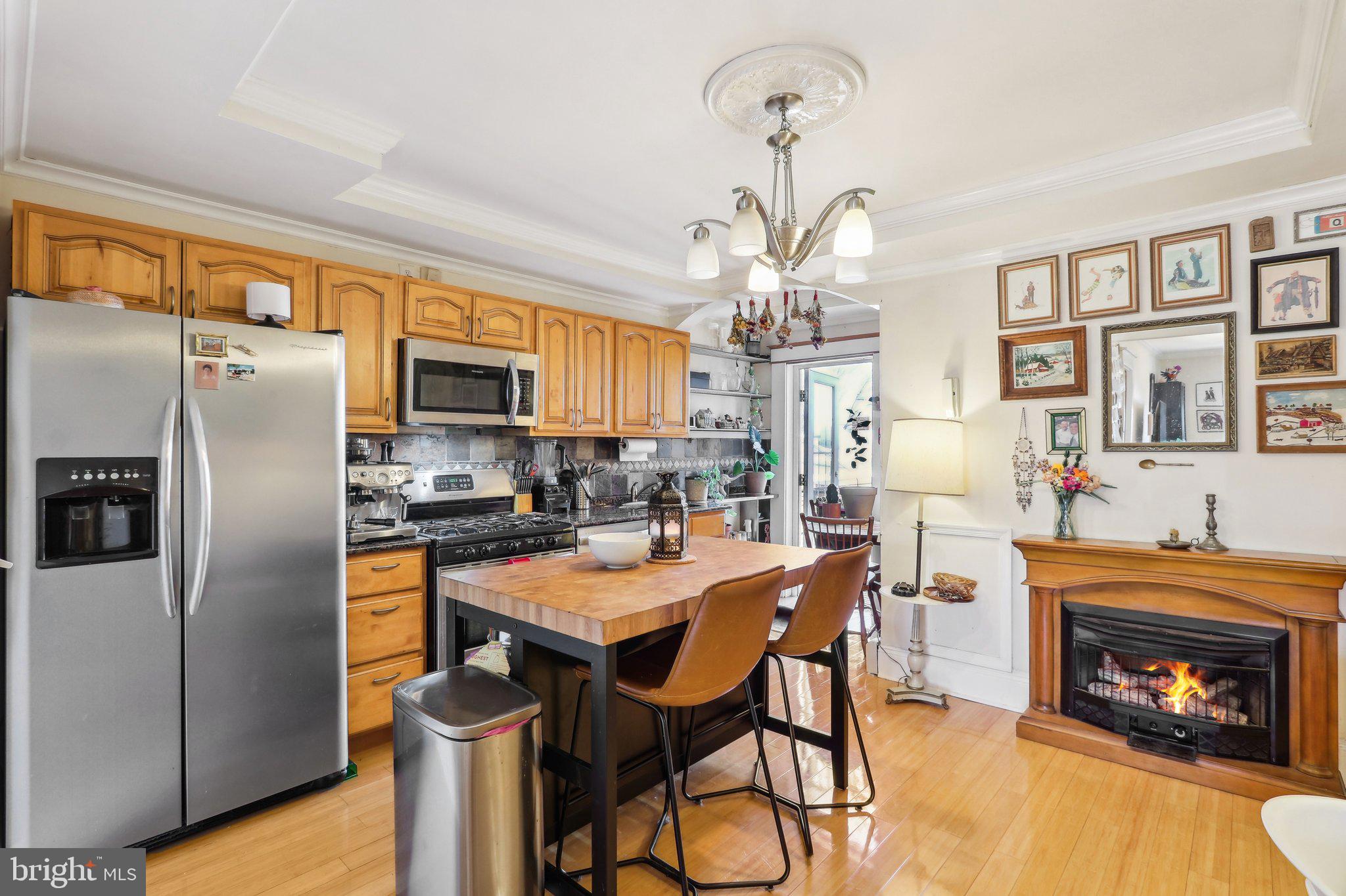 Location, Location, Location! From the moment you step into this charming, updated 1 bedroom, 1 bath condo you will want to say SOLD Nestled in the popular Washington Square West Community, this condo is just blocks away from shopping, restaurants, Thomas Jefferson & Penn Hospitals and more! Unit 4F is located on the top floor of the building and as you enter the unit you will immediately notice the beautiful hardwood flooring and natural light flowing into the home. The updated eat-in kitchen offers granite countertops, custom tile backsplash, stainless steel appliances, pantry, ceiling fan, and a quaint gas fireplace/stove which creates a fabulous ambience for the unit. The spacious living/family room with large windows offers a great view of the city! The generously-sized bedroom, also with hardwood flooring, features large windows and a very spacious closet. An updated full bathroom completes the interior floor plan. A door from the kitchen opens to an exterior stairway, where you can take in the fresh air while enjoying your morning coffee. In addition, this unit has Exclusive Rights to the roof and attic directly above the unit. The common backyard & deck area offers a perfect respite where you can unwind and relax. Although there is laundry "hook up" in the unit, laundry facilities are located in the basement of the building along with a storage locker. A true bonus is the nominal monthly condo fee of $365 which covers utilities including gas, water, internet and trash expenses. This unit is a true GEM, in an extremely popular community in the City, offering a wonderful blend of classic charm and modern amenities....and it is convenient to everything that makes living in the City special! Book your appointment today!