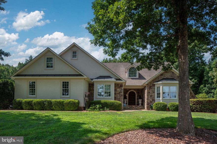 Welcome home to 11208 Knolls End—a breathtaking Sagun-built residence where timeless craftsmanship meets modern luxury.

Step through the grand mahogany front door and prepare to be captivated by architectural details and custom finishes that impress at every turn. The heart of the home, a newly updated gourmet kitchen, boasts Wolf and Sub-Zero appliances, exquisite cabinetry, and elegant designer touches—perfect for both quiet mornings and lavish entertaining.

Dine beneath a cathedral ceiling with exposed beams, warmed by the ambiance of a three-sided fireplace that connects the living and dining areas in perfect harmony. A double set of French doors invites you to the covered slate porch and expansive patio, complete with a hot tub, outdoor wood-burning fireplace, and extensive hardscaping designed for year-round enjoyment.

The primary suite is a serene retreat, featuring a cathedral ceiling with rustic beams, a luxuriously updated en suite bath, and multiple walk-in closets. Three additional main-level bedrooms offer hardwood flooring, custom window treatments, and walk-in closets, while the spa-inspired bathrooms showcase heated tile floors for ultimate comfort.

Upstairs, a versatile loft with full bath provides the ideal setting for a home office, playroom, or guest suite.

The lower level is an entertainer’s dream—featuring a spacious guest suite, recreation room, private gym, sauna, wine tasting room, and an incredible full bar equipped with every amenity needed to host unforgettable gatherings.

From top to bottom, this home defines perfection—combining elegance, comfort, and craftsmanship in every detail.

Outside your door, Fawn Lake offers resort-style living at its finest:
A 288-acre lake with beach and marina, championship golf course, country club, swimming pool, tennis and basketball courts, parks, trails, fitness center, and more—all within your gated community.

Discover the lifestyle you’ve been dreaming of at 11208 Knolls End—a home where luxury lives beautifully.