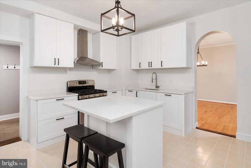 NEW PRICE — INCREDIBLE VALUE - Step into the charm and character of Annapolis living at 21 Woodlawn Ave — a beautifully updated 1905 home in the Germantown-Homewood community, blending timeless architecture with thoughtful modern improvements, all in one of the city’s most walkable locations.
This 3-bedroom, 2-bath home is filled with warmth and original character, featuring high ceilings, hardwood floors, natural light, and a stunning wrap-around three-seasons porch that acts like an extension of the living space. The renovated kitchen offers brand-new cabinetry, appliances, and finishes while maintaining the home’s historic charm. Additional recent updates include all new interior and exterior paint, newly refinished hardwood floors on the second level, bathroom upgrades, and the addition of a functional mudroom at the rear entrance.

Beyond the home itself, the property offers something truly rare in downtown Annapolis — an exceptionally spacious backyard with incredible flexibility and future potential. Whether you envision expanding outdoor living space, creating gardens, building an in-law suite or private office above/within the existing garage footprint, or exploring the possibility of subdivision (buyer to verify), the opportunities here add meaningful long-term value.

Bonus features include a walk-up unfinished attic with potential to create additional finished living space, an unfinished basement with laundry area and exterior access, and off-street parking that is increasingly hard to find this close to town.

Enjoy the lifestyle that comes with this location — just moments from downtown Annapolis, City Dock, Navy-Marine Corps Memorial Stadium, Naval Academy events, Maryland Hall, restaurants, coffee shops, the library, and the Poplar Trail bike path.

A rare opportunity to own a piece of Annapolis history with space, flexibility, and future potential close to the heart of the city.