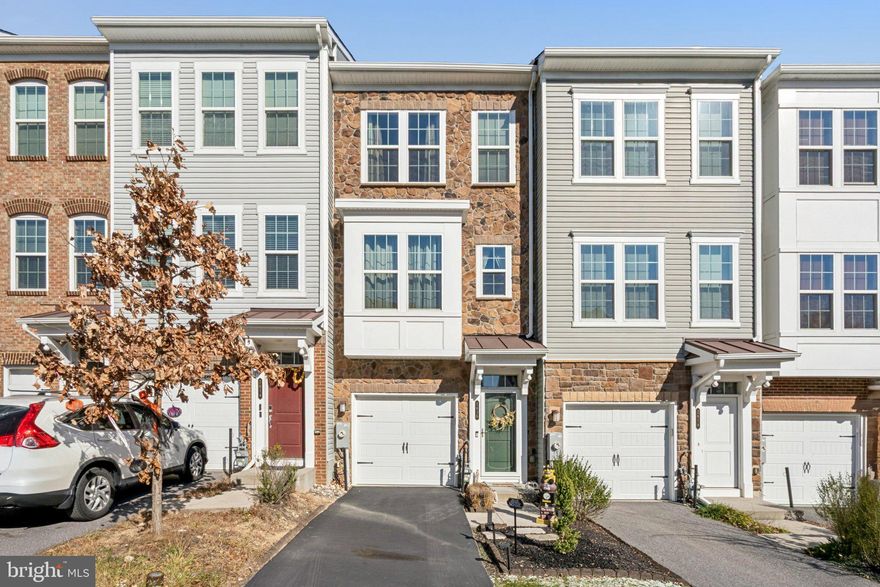 Experience elevated living in this beautifully updated 5-year-old townhouse, perfectly situated in one of the community’s most sought-after neighborhoods. This 3-bedroom, 3.5-bath home showcases a bright, open main level with hardwood floors, granite countertops, stainless steel appliances, and a newly installed custom backsplash that adds a modern touch to the kitchen. Just off the living area, an upgraded, tree-lined deck offers a peaceful retreat—ideal for grilling, relaxing, or entertaining.
Upstairs, you’ll find two generously sized bedrooms, including a serene primary suite with an en-suite bath and spacious closets. The third bedroom is located on the lower level alongside a full bath, making it perfect for guests, a home office, or a private getaway. The lower level also features brand-new LVP flooring and opens directly to the fenced rear yard for effortless indoor-outdoor living.
Thoughtful upgrades continue throughout the home, including fresh, newer paint and custom garage shelving that maximizes storage and organization. A one-car garage and driveway parking add everyday convenience.
Located in an amenity-rich community offering 3 poolS, a fully equipped fitness center, and 2 dog parks, this move-in-ready home combines modern style with unmatched neighborhood perks. Don’t miss your chance to make it yours!