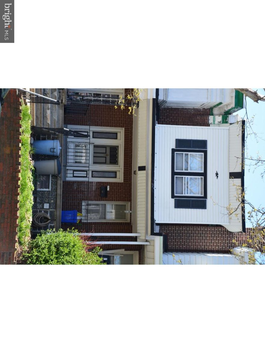 Adorable porch front row with hardwood floors throughout. Modern updated bathroom and kitchen. Excellent closet space in bedrooms. Finished basement with powder room. Rear driveway to attached garage with direct inside access. Freshly painted throughout & roof recently recoated. Move in ready but needs some minor cosmetic finishing touches. Seller motivated! Make an offer!