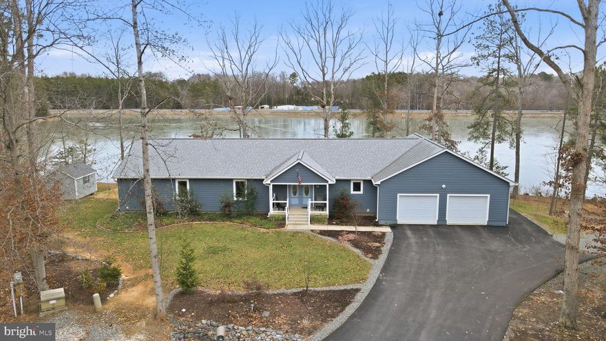Lakefront living reimagined to fit your needs! ...Don't miss out on this rare opportunity to own a beautiful over 2000+sq ft custom built lake home on a private cul-de-sac overlooking the water.  With over 220Ft of Lakefront and a personal dock this ranch style home is already handicap equipped to fit your needs for a lifetime of amazing views.  This thoughtfully designed home features a large foyer and living room area with open views to the water so you can sit and enjoy your coffee inside or outside while watching the sunrise over the water. The kitchen has lots of storage space with a butlers pantry, luxury vinyl tile flooring, beautiful quartz countertops, as well as backlit cabinet lighting, and a custom backsplash design. 
All the bedrooms are good sizes with built in closet shelving. And the oversized primary bedroom ensuite that has wonderful Waterview, a balcony area, and easily room for a sitting room or office area too. The primary bathroom has luxury vinyl tile floors, quartz counters, walk in tile shower, and a large walk in closet with custom built ins. The utility room is designed as a multifunctional laundry room with utility sink, and added storage cabinets and countertop space. There is an extended covered back porch perfect for enjoying not only lake views but also the wildlife and the many species of local and migratory birds including bald eagles and osprey that visit the lake. There are steps leading down to the water and private dock where there is great fishing and room for small boats. In addition, the backyard is fully landscaped & there is a whole yard irrigation system that feeds off the lake to keep your grass looking pristine. The extended oversized garage has room for anything you can imagine with a Sauna and/or hot tub hook up area, outdoor shower,  gym space, three bays, and room for your golf cart or tractor.  Plus, the whole house is handicap equipped with  4' wide hallways, 3' wide doors, pocket doors, and a concrete wheelchair ramp in the garage so you can truly make this your forever home. Paved driveway on cul-de-sac lot and storage shed (last section of the road is set to be paved this year by the community). Lake Land'Or is a wonderful private gated lake community with tons of amenities for the family to enjoy such as a gym, clubhouse, archery range, basketball courts, lake access, playgrounds, pool, & so much more.  This community is also  easily accessible from I-95 or Rt 1. (2.58% assumable loan option could be explored for VA buyers as well) Come out and tour this house before its gone!