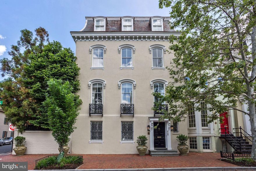 Everything about this property is extraordinary. Prominently and beautifully sited on a perfect block in Georgetown s East Village, this historic Georgetown mansion has wonderful proportions and light throughout. Renovated and restored from top to bottom the house is comfortable and easy to live in, but not at expense to the grandeur of its formal spaces. The double living room has 11ft ceilings and fantastic light flowing in from its massive windows. This room alone is one of the special entertaining spaces of Georgetown. The attached dining room is also large enough to accommodate any formal occasion. The spacious proportions continue to the upper levels of the house where a master suite includes two ensuite bathrooms, a dressing room, and a separate sitting room, and there are additional bedrooms for family or guests. The wonderful, walled, private garden includes a pool and manicured terraces with a large water feature. The three bay garage with, guest quarters above, is ideal for an office or help quarters.