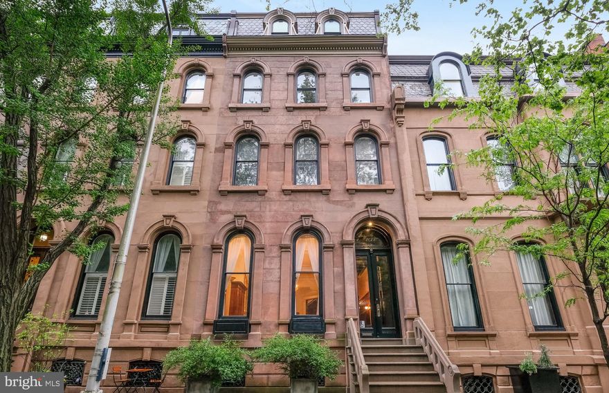DYNAMIC RITTENHOUSE SQUARE  RESTORED MANSION! This 7000 Square foot MUSEUM CALIBER residence  offers perfection, luxury, and a return to elegance without compromise. FIRST Floor formal  living room with 15 ft ceilings, perfect crown molding and fireplace, is just off THE most OUTSTANDING dining room , with its own fireplace with  7 foot+ mantle, hand painted ceilings, and 2 French doors leading out to terraces over looking the charming  patio area. Master chef's kitchen with radiant heated floors, fire place, high end appliances and what feels like miles of counter space.  Double doors leading out to the patio, and access to the TWO car gated PARKING area, complete this level. On the second floor of this SUN-FILLED brownstone , you will encounter the MOST EXQUISITE main bedroom, with a fireplace, decorative plaster ceiling, dressing room with it's own  fire place, and an  all marble bath. There is also a library on this level, with it's own fireplace,  antique  restored wood carvings, and a beautiful south facing window and window seat.
The next 2 levels boast 4 additional perfectly appointed bedrooms and 3 additional Baths. Each level of this home is more magnificent than the next, boasts original GUIDED AGE type woodwork, and decorative hardwood floors.  Minutes from The best dining , entertainment,  University of Pennsylvania,  Drexel University and Of course RITTENHOUSE SQUARE.