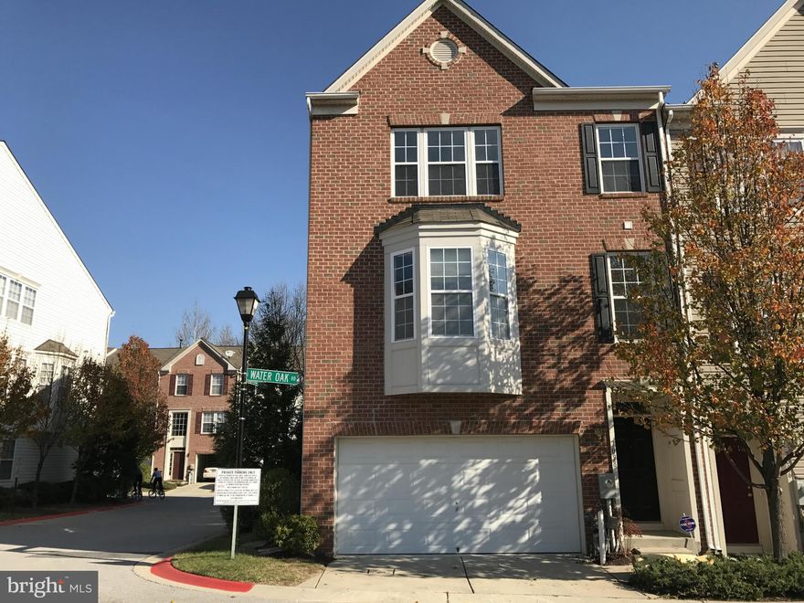 Stunning bright end unit townhouse. Huge eat-in kitchen/dining space. 3 Bedroom, 2 1/2 Bath, Fireplace, 2 car garage. Sparkling hardwood floors on main level. Stainless steel appliances, new washer/dryer. New refrigerator to be installed. Finished basement. Freshly painted and new carpet. Community includes a clubhouse and pool. Ample parking! Great location - quick access to I-95 to DC/Baltimore.