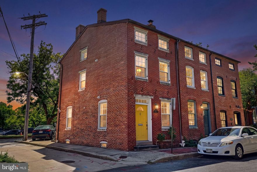 Located at the crossroads of Otterbein and Federal Hill, this renovated end-of-group Baltimore rowhome delivers the perfect blend of historic character and modern convenience with European white oak flooring on all levels. Renovated in 2018 and freshly painted in 2026, the home features a sun-filled open foyer entry, main lvl powder room, coat closet, oversized living space, and beautifully updated kitchen (soft close cabinets, quartz countertops, and stainless steel appliances). Upstairs, two spacious bedroom suites offer timeless renovated bathrooms and flexible living. Rare rear brick parking pad doubles as a private patio oasis — a true city luxury — plus additional convenience within Area #8 parking district. The unfinished basement is a perfect place to store any extras. Check out the features and updates sheet for more details. Just unpack and enjoy city living moments from dining, entertainment, downtown employers, and stadium districts. Don't wait. Schedule a showing to check out this stand-out property in person, it could be YOURS!