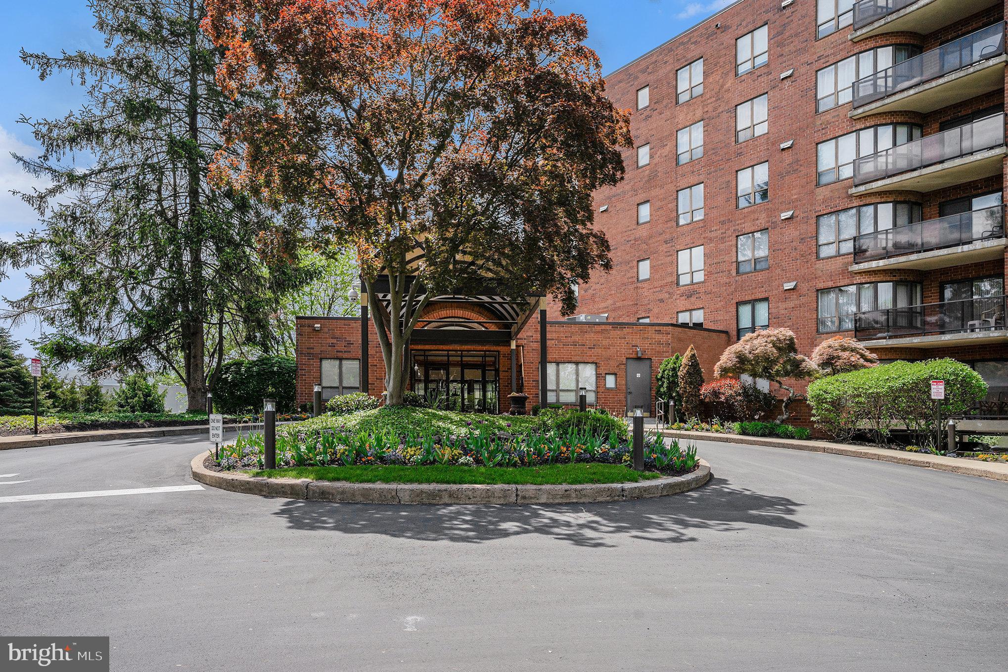 ** Back on the market due to buyer not being able to satisfy a sale and settlement contingency ** Welcome Home to this exquisite 2-bedroom, 2-bathroom condo in the highly sought after Breyer Estates condo community in Elkins Park! This spacious and light-filled open concept condo boasts over 1,100 square feet of living space. As you enter the unit you are greeted by a gracious foyer area which leads right into the huge living room space that gets loads of natural light with the wide bank of windows and sliding glass door which leads to your private patio that overlooks the woods perfect for enjoying the outdoors with that morning cup of coffee or early evening cocktail. The sellers enjoy having two unique sitting areas in the living area, one which features a custom built-in entertainment center cabinet and sideboard which opens out into a formal dining room table that can seat everyone for your holiday get togethers; however, this can be set up as a traditional living room and dining room as well if desired. Off of the living room area you will find the large, bright kitchen with white cabinetry that offers an incredible amount of counter, cabinet and pantry space along with high quality appliances including a brand new dishwasher. As you walk down the hallway to the other end of the condo you will discover the wonderful bedrooms and baths. The first bedroom is well appointed with lots of closet space, the spacious full bath across the hall features a spacious stall shower. At the far end of the hallway is the primary bedroom featuring a spacious walk-in closet and across the hall is a gorgeous, modern full bath. Both bedroom closets feature custom closet organizers to maximize space. Both bedrooms have a wonderful southwest view out to the tranquil wooded area surrounding the property. This condo offers so much Including: in-unit laundry featuring a new washer and dryer, new HVAC system installed in 2022, a new garbage disposal, brand new toilets in both bathrooms, beautiful, gleaming hardwood floors, a deeded parking spot in the gated and secured parking garage (Spot # 45) as well as a secure storage closet for additional storage space. Come and enjoy all that this top flight condo community has to offer … impeccably maintained year round landscaping, a beautiful in-ground pool area, walking trail, large community room with a kitchen that can be booked for private events, front desk security, brand new elevators, beautiful front lobby and building management that goes above and beyond. Just a short walk or drive to absolutely everything Elkins Park, Jenkintown and Wyncote have to offer including fantastic restaurants, shops, bars, shopping centers, parks, etc. Easy access to public transportation via SEPTA bus routes or the regional rail at the nearby Jenkintown train station; as well as easy commute access to Rt. 611, Rt. 73, Rt. 309 and the PA Turnpike. Enjoy one of the very best condos in arguably one of the most idyllic suburban neighborhoods in the area. Make your appointment right away and make this condo your new home!