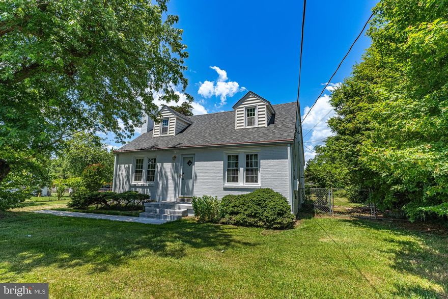 Location, location, location! Just minutes from Joint Base Andrews and simple access to Branch Avenue, Metro and local shopping. From the moment you turn onto East Clinton Street you will be wowed! The street has brand new sidewalks, curbing, gutters and paving.  The beautiful street leads you to an amazingly renovated brick Cape Cod on a large, park like lot. The  curb appeal is impressive with the fresh white paint and brand new architectural shingle roof! When you enter the property you are greeted with beautiful manicured yard with gorgeous flower beds, plantings & trees. The brand new front sidewalk will lead you to the front door. Once inside, the freshly refinished hardwood floors flow throughout the family room, dining room, hallway and main floor bedrooms. The family room has a beautiful fireplace with wood burning stove insert. Formal dining room is beautiful with chair rail and wainscotting trim.  The kitchen has been updated with stainless steel appliances. Two bedrooms and a full bathroom complete the main level. As you start up the main staircase, you will see the beautiful new carpet that flows throughout the upper level. There is a large open area at the top of the steps with storage and a window seat. The open area leads to the third bedroom as well as the primary bedroom. You will be amazed at the spacious primary bedroom and gorgeous bathroom. The large rear windows in the primary bedroom provide amazing views of the expansive backyard. The laundry room is located in the lower level along with a large open storage area. Outside you will find the oversized one car garage and an absolutely gorgeous, level rear yard. With over an acre of land, you will forget that you are still so close to everything the area has to offer.