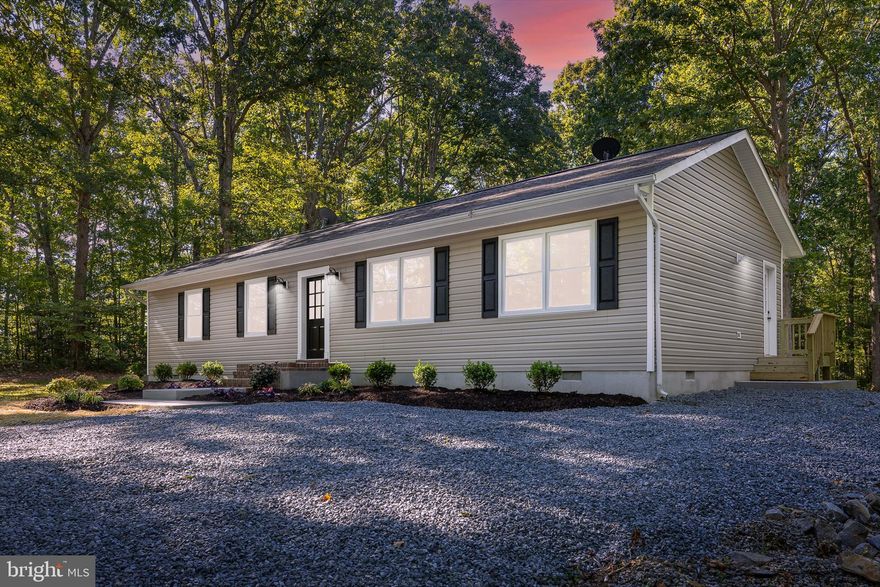 W O W.....Makeover is complete, and this is it for purchasers looking for the sweet deal. This home is conveniently located in the Spotsylvania Courthouse area, shopping, restaurants, schools, hospitals, and more. It has been renovated (PLUS ), boasting new: vinyl siding, windows, appliances, bathrooms, kitchen cabinets painted white, light fixtures, interior doors, paint throughout the whole interior, concrete walkway (front), concrete patio ( rear ), side porch, sliding door, gravel driveway was widened and new gravel, landscaping, insulation under the house, all the floors are newer laminate plank, and in great shape.....Now the PLUS: a brand new 3-bedroom conventional septic system. Home has a large rear yard, and the lot extends to the corner of the next street to the right of the property, lending for much privacy. All new upgrades were done meticulously by the owner, and look better than some new builds. This one will not last long, so make an appt to see & head on over.