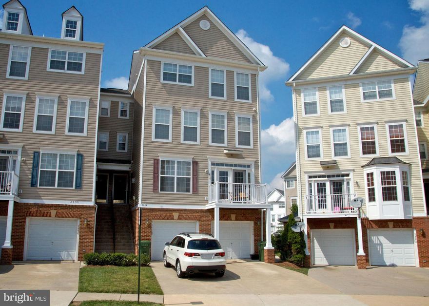 Immaculate 3BR/2.5BA TH style condo. 4 levels, 1 car garage & 2,650 sq ft of open living space. 2 gas Fps. Eat-in KIT w/granite counter tops, recessed lights & open to LR. 4th lvl MBR suite w/tray ceiling, WIC, french doors, sep shower/tub. BR lvl laundry. Bonus FR. Wood deck. Near planned Silver Line. Ready for immediate move in!