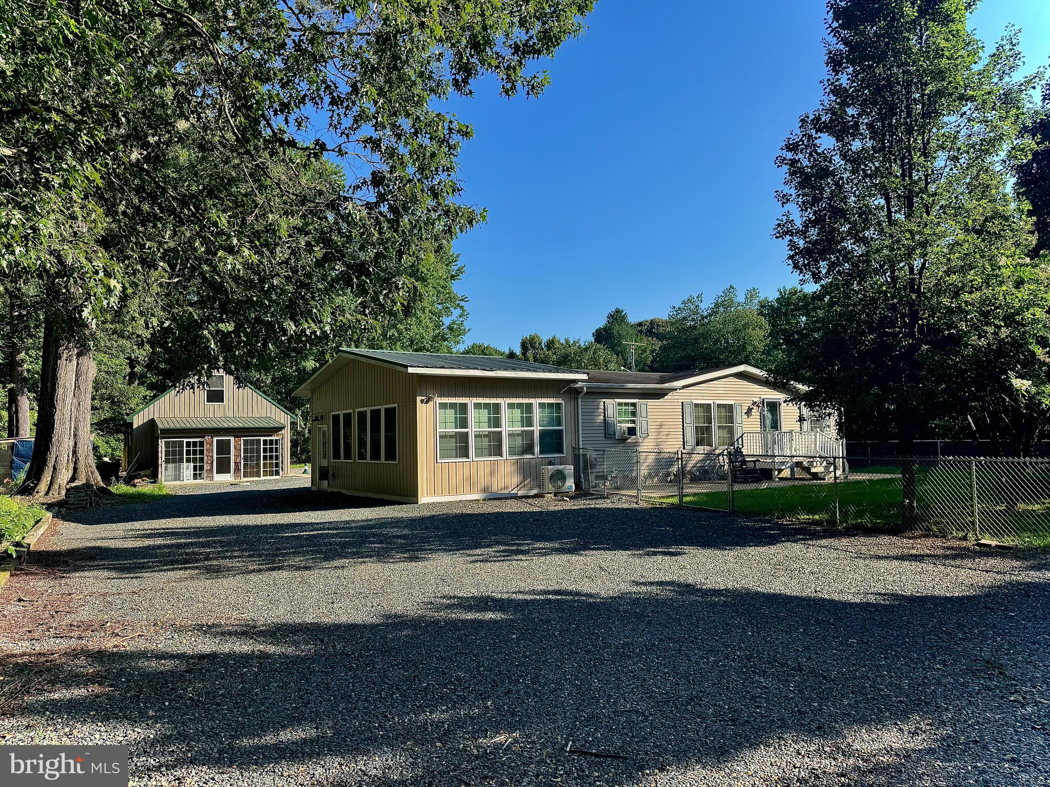 PROFESSIONAL PHOTOS COMING! Showings start 8/9
Looking for a home that has an oversized two car garage with electric, heated floors, water, toilet hookup bonus room above and a heated Florida room? Or are you looking for a one story home with hard wood floors, a huge bonus room with heated floors and an updated kitchen all within a mile from a public ramp? You found it! Store your water toys, camper or hunting gear here! The large drive through driveway makes it simple to maneuver your large toys around as it attaches to Broad Neck and Lovely Lane! If needed, the home has a whole home generator along with an updated BAT septic system in 2015! No fear of damage in the craw-space as it was encapsulated for piece of mind! Keep your pets & those close to you safe with fencing around the home adorned by arborvitae’s for privacy! Need to work from home? No problem, it’s easy to do with talkie fiber optic internet! Within 10 minutes from downtown Chestertown, 15 minutes from Rock hall, 40 minutes from Middletown DE, 1 hour 30 minutes from the Philadelphia International Airport & 1 hour 30 minutes from BWI. Start your small town country living now!