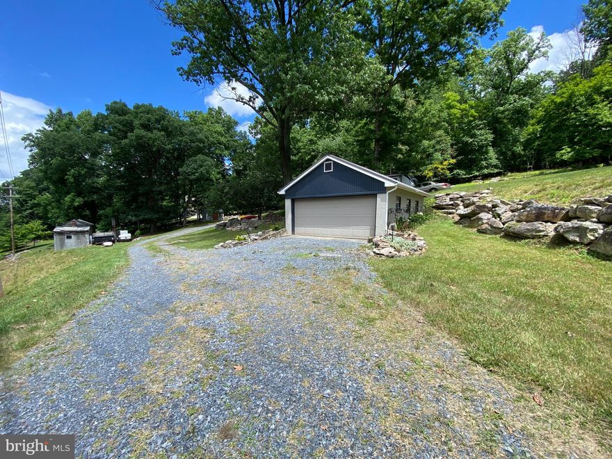 Great opportunity to own a wooded lot near Oakdale schools and build your dream home with a detached garage, shed, and electric already on site!!  If you're tired of living in a subdivision with neighbors in close proximity of your front door and windows and you've been looking for more space and privacy, this could be the one you've been looking for.  Recent Perc approval for 2 Bedroom, 2,000sf home (see disclosures for details from Health Department).  It may be possible to increase the Bedroom count based on adding a second septic reserve area to supplement the first septic reserve area. There's an existing well that supported an abandoned structure that needs to be brought up to current standards according to the Health Department.  The open pit is where the existing well is located.  Drill a new well or possibly connect to public water supply running along the front property line.  Survey completed by owners when they bought the property.  Look, plenty of space to park your RV as well.