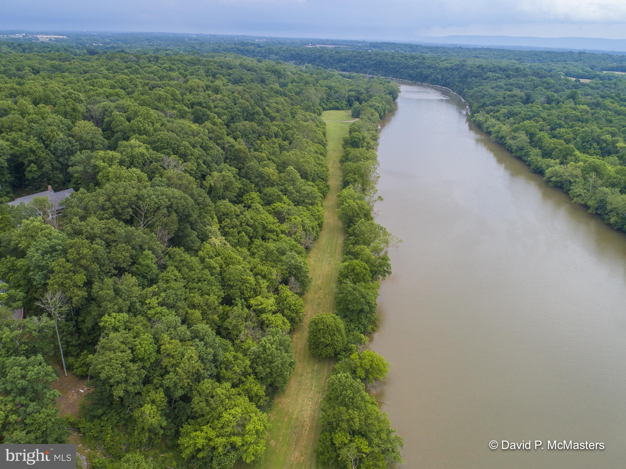 Entered as a Comparable. Modern updated home in very good condition with year round Potomac River views on deep water (between dams) with the C & O Canal Historic Preserve protecting land on the Maryland side of the river. Whitings Neck Equestrian Center is part of the community, which has riding/walking trails, including a bridle trail along the river. The common riverfront area has a boat launch, boat slips, dock, which are removed during cold weather, covered picnic pavilion and large flat lawn. The property is wooded, as is much of this gorgeous community. Conveniently located 7.8 miles from Shepherdstown and 8.9 miles from Spring Mills/Interstate 81.