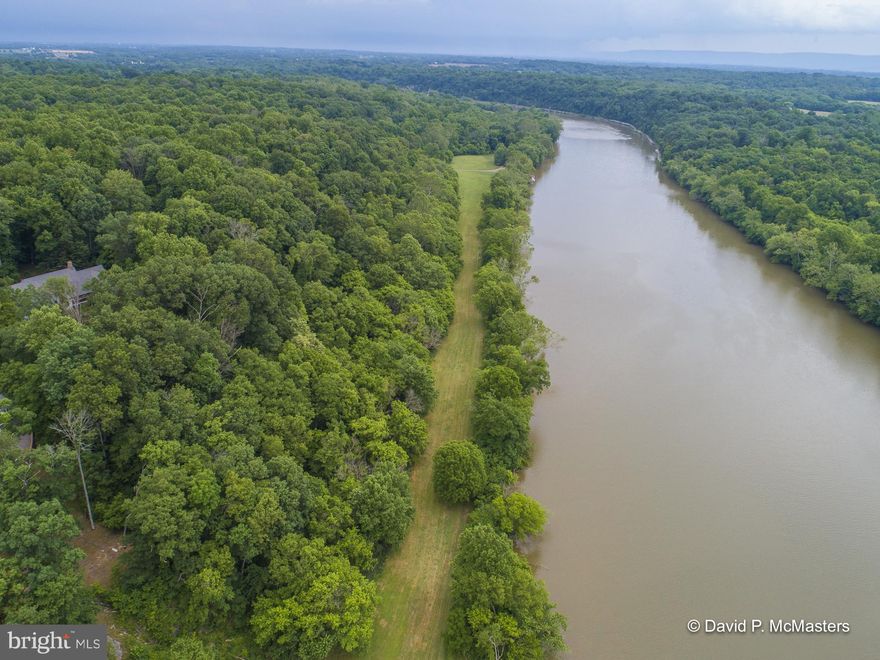 Entered as a Comparable.  Modern updated home in very good condition with year round Potomac River views on deep water (between dams) with the C & O Canal Historic Preserve protecting land on the Maryland side of the river.  Whitings Neck Equestrian Center is part of the community, which has riding/walking trails, including a bridle trail along the river.  The common riverfront area has a boat launch, boat slips, dock, which are removed during cold weather, covered picnic pavilion and large flat lawn.  The property is wooded, as is much of this gorgeous community.  Conveniently located 7.8 miles from Shepherdstown and 8.9 miles from Spring Mills/Interstate 81.