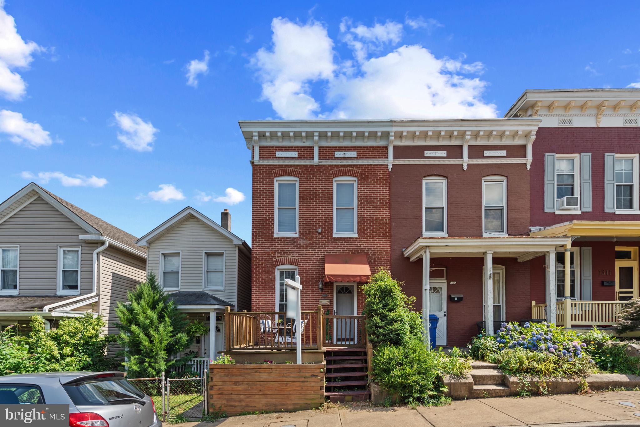 This MOVE IN READY solid brick rowhome on a quiet street is just minutes to everything! 1,500 sq feet of above ground living space AND a huge back yard. Big UPDATES include Central AC, HVAC, Water Heater, flooring, fresh paint, new gas stove, dishwasher and microwave. You will love the flow of the house with its' 9 foot high ceilings, spacious kitchen & outdoor living spaces. The large unfinished basement makes a great exercise room or update it for whatever space you need. Want a main level bathroom? Move the washer/dryer to downstairs and you'll have the space to put one in. Located just minutes to everything including downtown Hampden, Johns Hopkins, Druid Hill Park and the Baltimore Museum of Art just to name a few. Easy access to all the restaurants and culture that Baltimore has to offer! Meticulously maintained with plenty of street parking right in front of the house. An ideal home whether you are looking for your first house, ready to downsize or want to invest in a home with excellent rental potential.