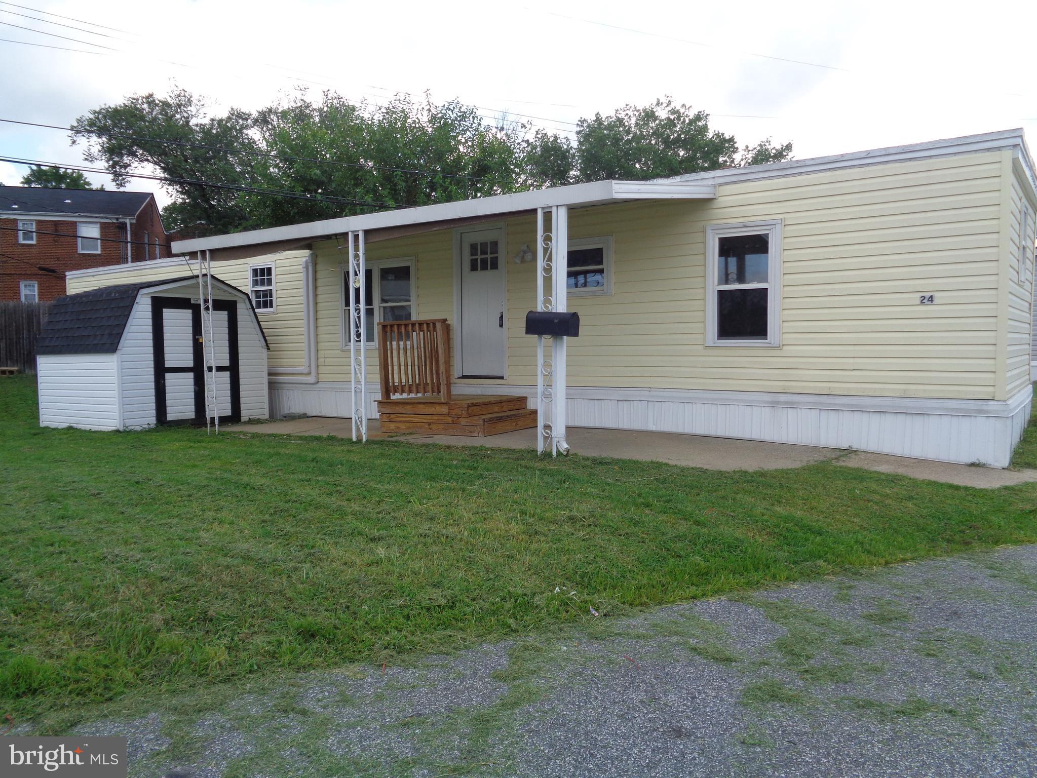 Rarely Available in Cool Breeze Fairly Small Park Two Bedroom One Bath Recent Updates, Painting, Floors ,Covered Front Porch, Large Rear Yard Shed. Ground Rent is Only $700 a Year