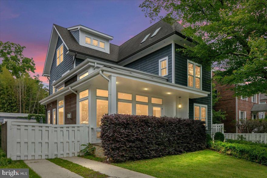 OPEN HOUSE CANCELLED! Experience urban living at its finest in this striking detached home offering nearly 5,000 square feet of luxurious living space spread across four finished levels. Located in the sought-after Lyon Village/Clarendon neighborhood with easy access to commuter routes, airports, public transportation, and Washington, DC, this home provides the perfect blend of convenience and sophistication. Upon entry, you'll be greeted by floor-to-ceiling windows that flood the main level with natural light, highlighting the stunning vaulted ceilings and open floor plan. The expansive gourmet kitchen, equipped with Wolf, SubZero, and Bosch appliances, is a chef's dream, while both casual and formal dining areas provide ample space for both living and entertaining. The main level also features an office with built-in shelving, a mudroom with ample storage at rear entrance, a guest half bath and convenient access to the rear patio, yard and detached garage. On the upper two levels, you'll find four bedrooms plus a bonus room with skylights, including two primary bedroom suites. Upper Level 1: Primary suite at rear of home, overlooks the yard and enjoys eastern sunrise views, has two walk-in closets, and a primary bath providing dual vanities, water closet, soaking tub and oversized walk-in shower with bench seating. Additional two bedrooms on this level share a full hall bath, and there's convenient side-by-side laundry. The uppermost floor boasts a second primary suite with soaring vaulted ceilings, a balcony with views - perfect for seeing the July 4th fireworks. The bonus room could serve as an additional bedroom, or even a yoga/meditation space, with 4 skylights. The walk-out lower level adds even more living space, with an additional bedroom, laundry room, full bath, recreation room complete with a wet bar, and mechanical room with additional storage. Outside, the front porch provides a charming space to relax and unwind. We cannot forget to mention the ample storage space in the home. Detached, oversized garage. Rear terrace and planter boxes in landscaped yard. A convenient location with easy reach of shopping, restaurants and entertainment that the urban village of Courthouse-Clarendon offers, including two metro stations, Mom's Organic Market, Whole Foods, Trader Joe's, multiple parks and bicycle trail, and access to variety of commuter routes and quick access to international airport.