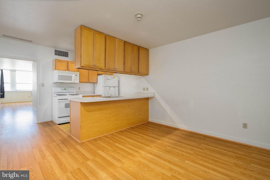 The Grand View Condominiums is a modern, pristinely kept high-rise in the heart of Philly's Chinatown, offering a welcome desk staffed 24/7, elevator access, a gym, on-site laundry, a peaceful garden, a dog run, a community lounge, and other sought-after amenities. Unit #415 is a large, updated 1 bedroom, 1 bathroom condo highlighted by a great layout. Stepping inside, you'll find a spacious living room with plenty of room to hang out. The galley-style kitchen has ample cabinetry space, a full suite of appliances including a dishwasher, and breakfast bar seating. Completing the unit is a sunlit primary suite with a huge bedroom showcasing tall windows, a double closet, and an extra-wide vanity, separate from the full bathroom, allowing for simultaneous use. The condo has central a/c, gas heat, and gas hot water. In addition to everything inside, this fantastic location earns a near-perfect Walk Score of 99! Chinatown is brimming with top-rated restaurants, popular shops, local markets, and lively entertainment. The Reading Terminal Market, the Fashion District, City Hall, and Franklin Square Park are all a few blocks away. There's also easy access to public transit, Broad St, I-676, I-76, I-95, and South Jersey. Schedule your showing today!