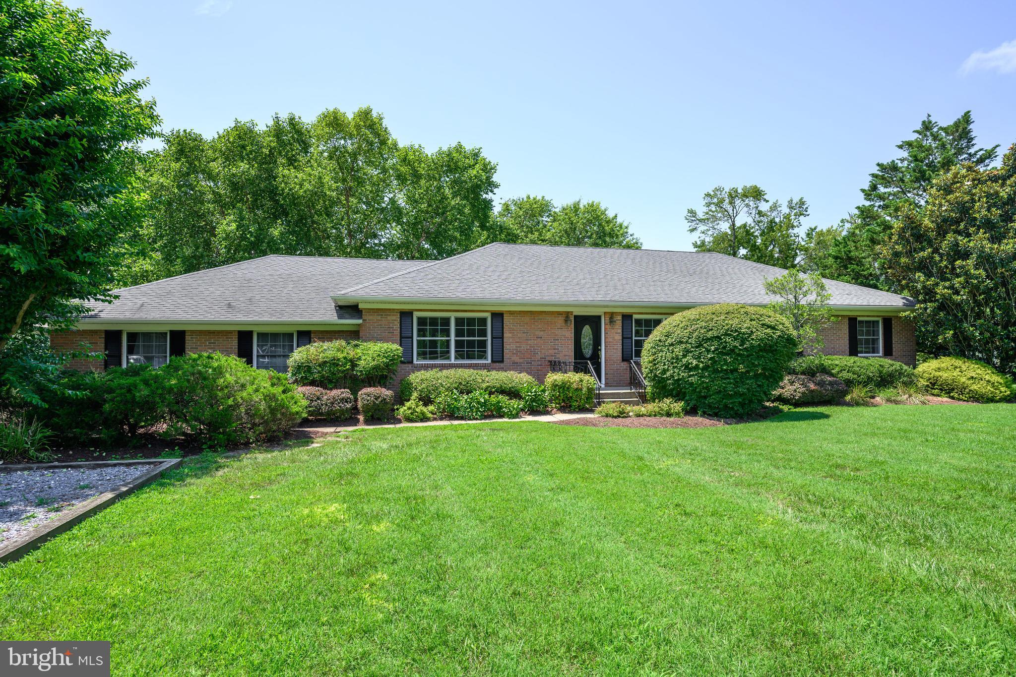Gracious, one-level brick home located along the 5th fairway of the Talbot Country Club golf course. This 3-bedroom, 2-bath residence is thoughtfully designed for entertaining and everyday comfort, with spacious formal living and family rooms, a dedicated dining area, and French doors opening to the rear patio from the kitchen, living room, and primary suite.
Features include a newer kitchen, gas fireplace, freshly painted interior, and beautifully landscaped yard with mature gardens. The attached two-car garage offers additional space with an adjoining laundry room and flexible office/work area. Meticulously maintained, this home is a rare opportunity in one of Easton's most desirable golf course communities—just minutes from downtown Easton’s shops, restaurants, and amenities.