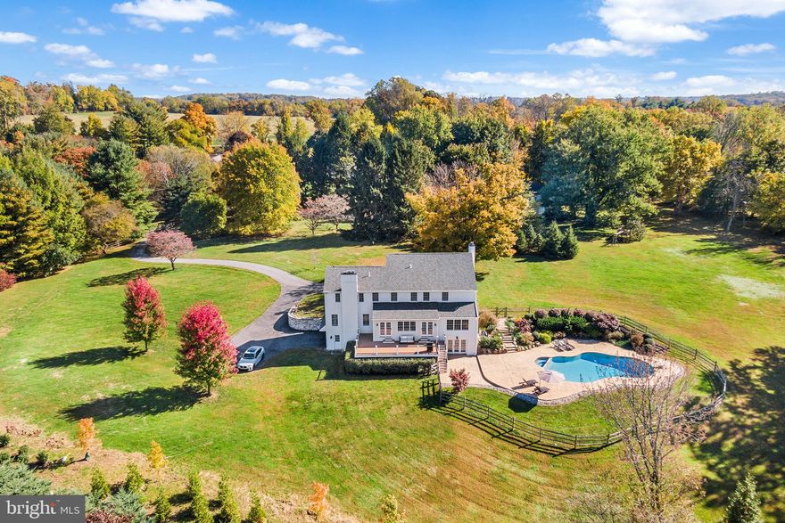 A rare opportunity in Easttown Township and top-rated T/E school district to own a captivating 4BR/3.5 Bath, 3,750 sf, 2.4-acre scenic retreat nestled down a long country drive. The current owner went to extraordinary lengths in 2014 to renovate practically every inch of this property with tasteful amenities including a beautifully landscaped pool and grounds, new deck. Interior finishes by master carpenter with exceptional attention to detail.   

Enter to a two-story foyer and beautiful staircase providing a welcoming entry point to the first floor, which features hardwood floors, solid doors, upgraded hardware, classic living and dining rooms with detailed wainscoting and moldings, neutral paint, and high-end wood plantation shutters. A sun-drenched dining room connects to a designer kitchen with neutral cabinetry, granite countertops, new Subzero® custom-paneled refrigerator and new Bosch® dishwasher. The kitchen also boasts a vaulted ceiling breakfast area with picturesque vistas and French door access to the rear deck, yard, and captivating layered garden landscaped pool. 

Adjacent to the kitchen you’ll find a generously sized family room with custom moldings, plentiful windows and a stone hearth fireplace. In addition, there is a fantastic office space with custom built-ins and spectacular views! Upstairs, in addition to 3 bedrooms (one of which has full bath), the spacious primary suite includes a fireplace, 2 walk-in closets w/built-ins, and a bathroom with granite top double vanity and oversized shower. Downstairs, the walk out garden level offers great finished space with LVT flooring and convenient access to the yard and pool. 

2014 renovations include a new roof, new stucco, 2-zone HVAC, new deck, Anderson® windows & doors, completely renovated pool and spa, new bathrooms, and more. Fantastic location, minutes from downtown Berwyn and Paoli, along with several premier private schools and Main Line destinations.
