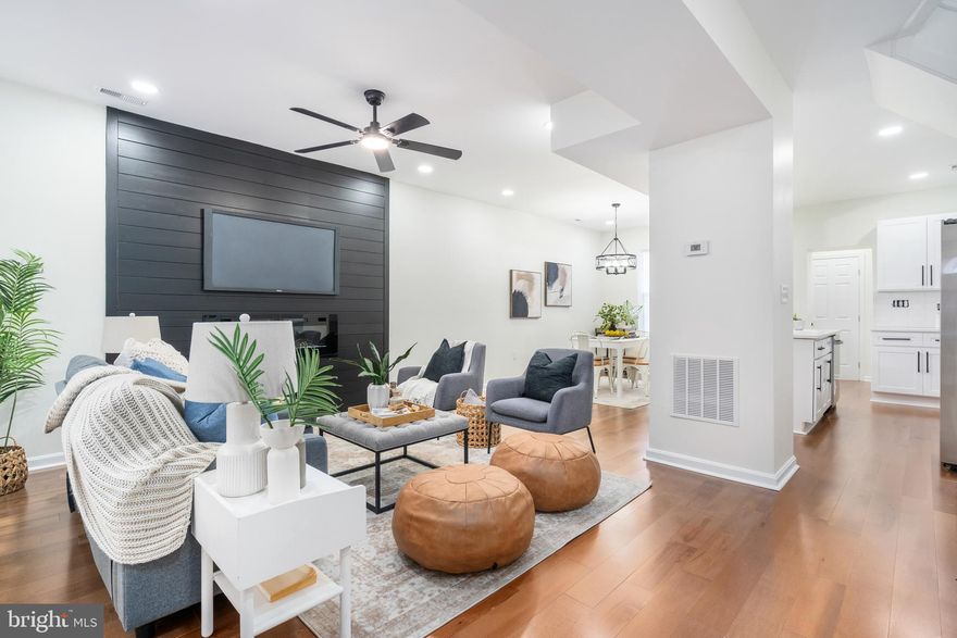 Welcome to your dream home in the heart of Baltimore City! This fully renovated row home, located in the vibrant Mondawmin neighborhood, offers a perfect blend of modern luxury and classic charm. With over 1,900 square feet of living space, this spacious property is designed to meet all your needs. Key Features 4 Spacious Bedrooms: Plenty of room for family, guests, or a home office.3 Full Baths + 1 Half Bath: Each bathroom is tastefully updated with contemporary fixtures and finishes. Modern Kitchen: Equipped with stainless steel appliances, sleek countertops, and ample cabinet space for all your culinary adventures. Charming Living Area: Features an elegant shiplap wall and an electric fireplace, creating a cozy yet stylish ambiance. Parking Pad: Convenient off-street parking at the rear of the property. Additional Highlights: Fully Renovated: Every detail of this home has been carefully updated, ensuring a move-in-ready experience. Bright and Airy: Large windows throughout allow for plenty of natural light, enhancing the open floor plan. Prime Location: Situated in the Mondawmin neighborhood, enjoy easy access to local amenities, parks, schools, and public transportation.