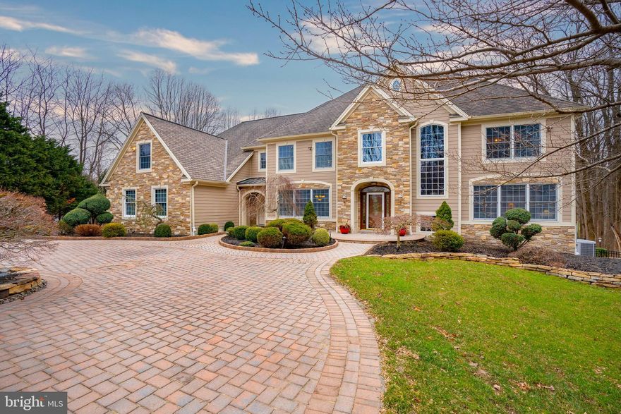 An idyllic home designed perfectly for family, friends, and entertaining – both inside and out.
The exterior is a combination of stone and Hardie Board siding, an upgrade from the original
stucco. The home is nestled against a nature preserve with privacy and a beautiful setting that
can be enjoyed from the upper level three season room and deck or lower level patio. This
upper level space has stairs which lead down to the expansive lower-level patio that has a
fireplace, outdoor kitchen, in-ground spa, and lots of seating space. The outdoor living space is
also accessible from a gorgeous lower level that has a large bar, wine room, theatre room,
fitness room, and space for a pool table, gaming table, and arcade games. Additional space for
guests to stay, a full bathroom, and ample unfinished storage complete the basement. Both of
these indoor and outdoor spaces were additions added by the current owner. Other upgrades
have included a paver circular drive, front pillars, hardscaping, landscaping, built-ins, custom
closets, and much more. Each of the five bedrooms are comfortably large and have ensuite
baths. The primary bedroom includes a sitting room and his and her closets and bathroom
spaces. It is set-apart from the other bedrooms up the formal staircase and has views of the
surrounding preserve that never get old and always provide wildlife viewings. On the main floor
the kitchen is a chef’s dream with a Sub-Zero built- in fridge/freezer, Wolf ovens and stove,
Bosch dishwasher, generous cabinet space, and a walk-in pantry. A formal dining room and a
breakfast room are on either side of the kitchen with a Butler Pantry connecting the kitchen to
the formal dining room. Multiple formal and informal living spaces, a large foyer, and two half-
baths complete the main level. You will feel like you have arrived home when you come tour
this one-of-a-kind Wilkinson built home.