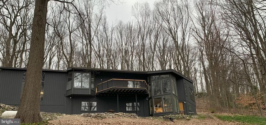 An amazing opportunity to own this view of the spectacular and sought-after Valley Forge Mountain! This Paul L’Esperanza contemporary home is tucked away on a 5.4 acre lot. Enjoy privacy, the beauty of nature and serenity, all the while being minutes from the conveniences of suburbia. With over 3,400 square feet of living space, this home has had an amazing transformation to every room keeping the integrity of md-century throughout.  On the main floor, cathedral ceilings paired with lots of windows brings the outside in and the open concept floor plan is great for entertaining! A spacious new kitchen is complete with a central island, additional entertaining/breakfast island, and  a quaint breakfast nook overlooking the front yard through bay windows. Completing the main floor is the master bedroom and a master bath newly updated with a double vanity, a wall of windows and an open natural stone shower, finished with heated floor.  Descend the spiral staircase to the lower level where you'll find two more generously sized bedrooms, a full updated bathroom, laundry room and great room, including a pool table. A 2-car garage with finished loft storage space above is attached to the home. Convenient to all highways, this property is also minutes away from Valley Forge National Park and an abundance of local shopping and entertainment options. *Due diligence for possibility of subdividing would be necessary.  DO NOT DRIVE UP DRIVEWAY WITHOUT AN APPOINTMENT.