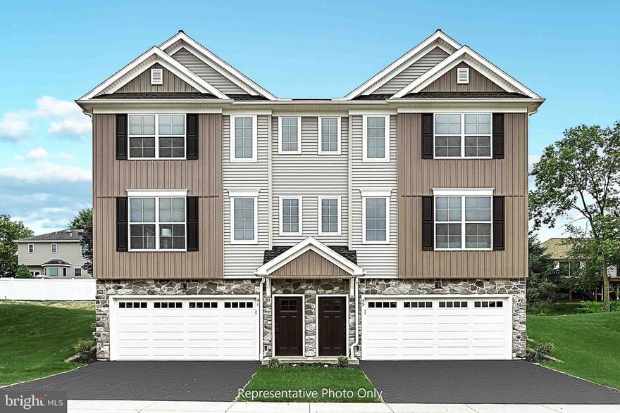This 3-story townhome includes a 2-car garage, finished basement, and a patio for outdoor living. On the main level, the spacious living room is adjacent to the kitchen and dining area. The kitchen features attractive cabinetry, granite countertops, and stainless-steel appliances. The 2nd floor boasts 3 bedrooms, 2 full bathrooms, and laundry. The owner’s suite includes a private bathroom and an expansive closet.