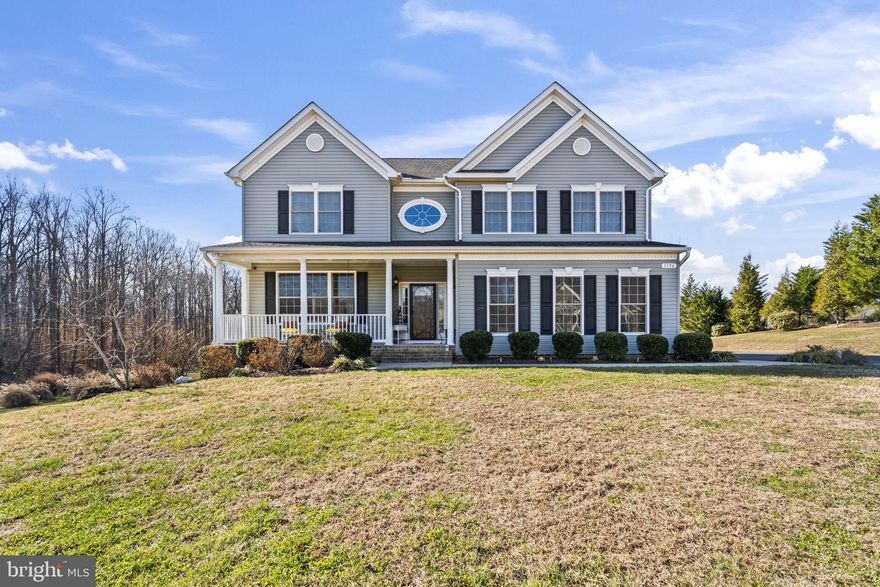 Prepare to be wowed by this beautiful  Belmont model on an impressive 2.72 ACRES of land - one of the largest lots in the entire neighborhood.  The lot is surrounded by woods and custom landscaping giving unbridled privacy. Sip your coffee on your expansive 14 x 16 ft back deck or cozy front porch.  Inside you will be greeted by a grand staircase & a soaring 2 story foyer.  Rich hardwood floors throughout the foyer, living room & separate dining room where you host all of your family gatherings.  The home was designed with a 2 foot extension at the rear of the home expanding the kitchen & family room.  Enjoy Quality Built Homes "grand" kitchen with upgraded maple cabinetry, luxurious granite counters, double wall oven, gas cooktop, HUGE island for gathering & extra prep space.  What is also special about this kitchen's design is the extra wall of cabinets, with room for a coffee bar, and an extra mini fridge to keep all of your beverages cold.  The eat in kitchen opens to the family room that is lined with windows for tons of natural light,  Cozy up to the gas fireplace on these cold nights.  Also on the main level is a true laundry/mudroom with custom built in cabinetry unlike most other Belmont models. The main & lower level boast 9 ft ceilings making the house have more grandeur.  Upstairs you will find an oversized primary suite, with 2 walk in closets.  Relax after a long day in the primary bath with jetted tub, and tiled shower & dual vanities.  3 other ample size bedrooms & bath surround the winding staircase.  Enjoy a fully finished walk out lower level.  There are 2 large recreation spaces, a bedroom & full bath!  All systems are energy efficient & have been serviced regularly to include the dual zone HVAC, water softener, on demand TANKLESS gas water heater, and septic was pumped just 2 years ago. The 500 gallon propane tank is OWNED so you can have your choice of where to purchase gas. Yard also has an underground DOG fence! Home rarely come on the market in the coveted Farms at Hunting Creek. With over 170 homes all on 1 acre or more, enjoy tree lined sidewalks, a small lake to throw in a line, a playground, gazebo, basketball court & a soccer field. The community offers the fun of food trucks, and holiday decorating in like none other. I live in the neighborhood myself & can personally attest to this! Zoned for AWARD winning SCHOOLS - Plum Point Middle, and HUNTINGTOWN HS!! Close to Prince Frederick for restaurants & shopping, and an easy commute to DC, Annapolis, Andrews AFB, Patuxent River, etc. Beautiful Calvert County offers a rural lifestyle that is surrounded on water both sides for boating, kayaking or just enjoying the view.