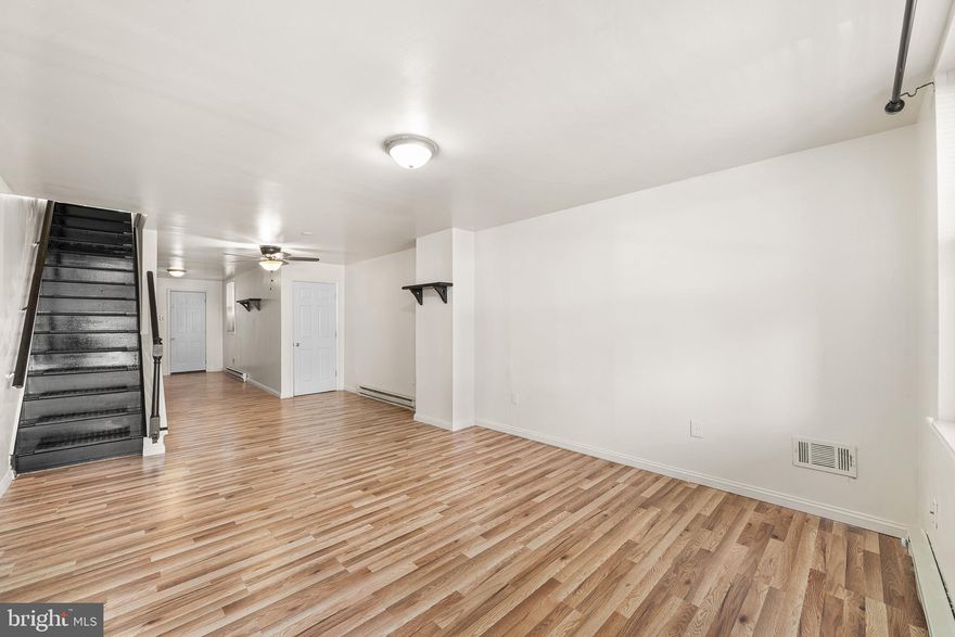 Welcome to 5236 Harlan Street, a bright and spacious 3-bedroom, 1-bath home in Carroll Park, PHA/Section 8 approved and ready for move-in. The main floor features a straight-through design with hardwood flooring and a clean, functional kitchen complete with wooden cabinetry and plenty of space for cooking. Upstairs, all three bedrooms offer hardwood floors and great natural light, giving you flexible options for rest, work, or additional living space. A full bathroom completes the second floor. The basement provides ample storage, and out back you’ll find a large yard, perfect for relaxing or entertaining. With its bright interior, practical layout, and outdoor space, this home delivers both comfort and convenience.