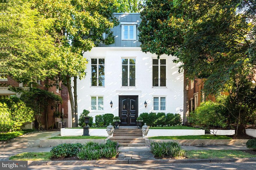 Fully detached residence has been tastefully renovated with  ideally proportioned spaces for large-scale entertaining indoors and out.   Originally built for an Ambassador, this bright and airy home offers a formal receiving foyer, grand central staircase, ballroom-sized living room, dining room/orangerie, large entertainer's kitchen, and a working elevator to all floors .  With 5 Bedrooms, 4.5 bathrooms and 4,752 sq. ft. of living space, the home provides an ideal set up for work-from-home offices and also offers private space for an in-law suite or au pair. The interior boasts beautiful crown mouldings, sunlit floor-to-ceiling windows, dark-stained hardwood and marble floors, high ceilings, and Carrara marble.  The landscaped garden  includes a large slate patio and a majestic American Heritage elm tree.

The large French front doors of the home open into a spacious foyer with marble floor. On the entry level are two large bedrooms or offices with new ensuite baths, newly constructed laundry room with cabinetry, Carrara marble countertops and Electrolux washer and dryer. In addition, there is a mudroom, one-car garage with new garage door and large storage or potential wine cellar.

A grand central staircase leads to the upper floors. The second floor consists of an Embassy-sized double living room with large French doors, wood-burning fireplace and built-in shelving. The sumptuous eat-in, renovated kitchen showcases a six-burner Viking stove, Bosch double wall ovens, two Bosch dishwashers, Viking French door refrigerator, large marble topped kitchen island with prep sink, and brass fixtures. 
Adjacent is a sizeable dining room with marble floors. All-glass new French doors in kitchen and dining room lead to private rear yard and slate patio featuring mature landscaping and a beautiful American Heritage tree. 

The third level brings a spacious owner suite with bedroom, built-in closets, large bath with double sinks, marble countertops, all-glass shower, a separate water closet and marble-clad walls and floors. A second and third bedroom (or large office with built-ins, wood burning fireplace, Murphy bed) with hall full bath, make this home a special and unique property for the most discerning buyer.