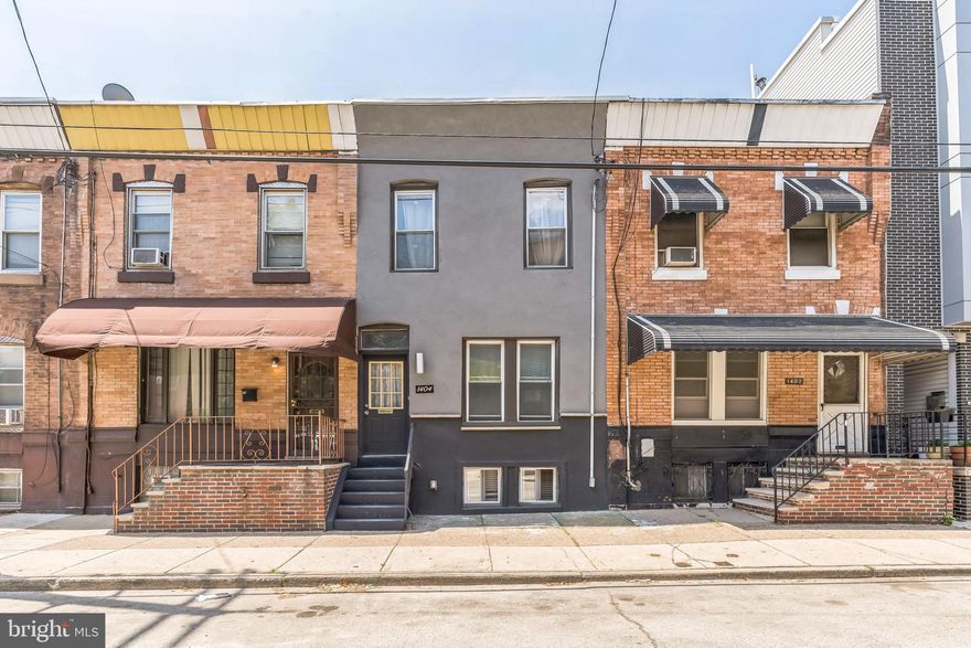 Welcome to 1404 S 24th Street, a 4-bedroom, 1.5-bath brick townhome located in the heart of Point Breeze. Offering approximately 1,310 sq ft of interior space, this 2-story home blends classic 1920s charm with great potential for modern updates. The main floor features a spacious living and dining area, original hardwood accents, and a convenient half bath. The kitchen is ready for a custom refresh and opens to a small backyard perfect for grilling or gardening.

Upstairs, you’ll find four well-sized bedrooms and a full hall bathroom. The full basement offers ample storage and utility space, with the possibility of future finishing. Whether you're a first-time buyer, investor, or looking for a home to renovate and make your own, this property offers flexibility and opportunity.

Located just steps from Wharton Square Park, close to public transportation, shops, restaurants, and major highways. With its RSA-5 zoning and a strong rental market in the area, 1404 S 24th St is ideal for an owner-occupant or investor seeking value in one of South Philly’s fastest-growing neighborhoods.