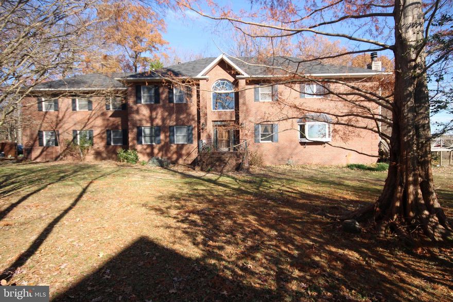 Prime location in Shady Side, MD, with great water views at the mouth of Jack Creek and Chesapeake
Bay on 1.128 acres. The home is sold "AS IS"- NO REPAIRS BY THE SELLERS. With some updating, this would be a lavish home. This home offers rooms with 5,266 square feet of living space crown moldings and a 2-car garage. 3 bedrooms, 3.5 baths, recreation room, formal dining room, living room with brick fireplace.  A Bar with seating for six, wine refrigerator, and sink(not hooked up). Bonus room or office on the main level. The primary bedroom offers two walk-in closets, a kitchen with stainless steel appliances, a trash compactor, a JennAir propane grill, and 2 burner gas cooktop. A makeup room with a small sink and a deck overlooking the water. The primary bath has a separate shower, soaking tub, and recessed lighting.  Entry foyer with a chandelier and coat closet. The Kitchen has a 5-burner gas cooktop,  electric double wall oven, and JennAir propane gas grill.  The hot tub is all glassed in and looking at the water. Trex deck allows for relaxing or entertainment on the waterfront.  14 x 20 shed with two work benches. A paved driveway sits off the road to allow for privacy on the waterfront and backyard. There is no dock, but two pilings are in place.  Owners are relocating and are serious sellers. Offered under-assessed value by $136,400.