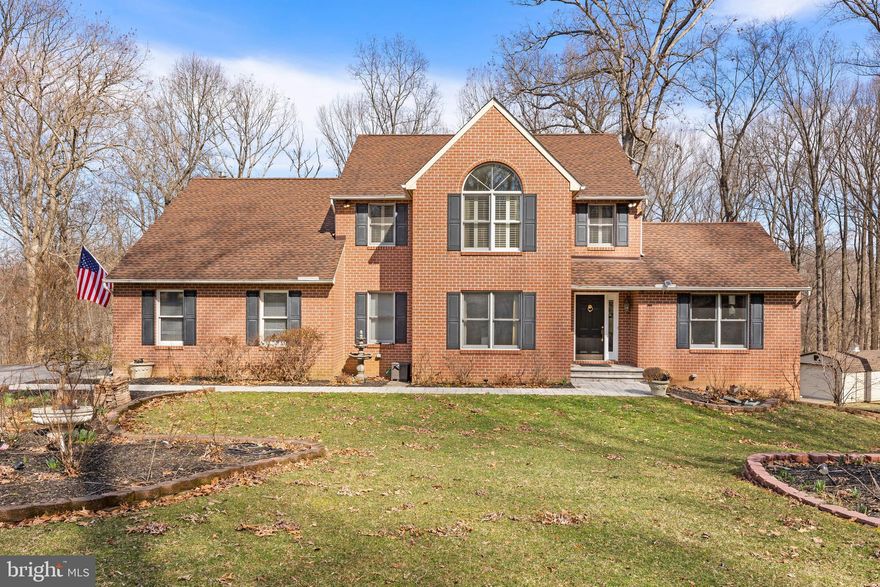 Live privately and in harmony with nature on this sizable 3.3 acre lot, encircled by a gorgeous mature tree canopy, at the end of a tree-lined drive. Impressive updates both inside and out including:  50-year Architectural shingle roof; a beautifully reinvented eat-in Kitchen & Laundry areas w/ new windows, 42" cabinetry, stainless appliances and striking granite countertops; supremely cozy HEATED LVP Family Room flooring; "Marathon" water heater; simply fantastic expanded Outdoor Living & Hobby spaces that now feature a rear paver patio, SunSetter electric Deck awning, steps from the Deck to the patio/ rear yard and a shed with full electric supply! Choose from two gorgeous spaces in which to relax in front of the gas fireplaces: Living or Family Room and cook with professional ease for friend, family or self on the 5-burner gas range. An expansive Owners' Suite offers a huge picture window w/ plantation shutters, large walk-in Closet & a luxury Bath w/ decorative dual sink vanity, stall shower and jet/spa tub. The finished walkout Lower Level w  built-in Bar presents abundant and versatile space to accommodate your needs:   Rec Space/ Billiard Area/ Work-at-Home/ Entertain the Crew... Whether hosting fun for a large bunch or just enjoying the soothing sounds of nature for one, you'll adore the tranquility, flora and fauna that this sylvan setting has to offer!