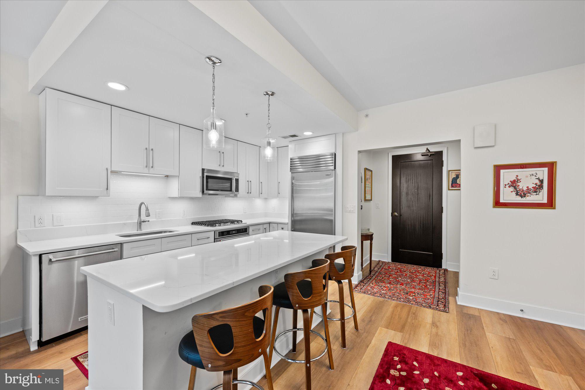 ***SUNDAY, SEPT 14 OPEN HOUSE, 2-4PM***Discover an exceptional opportunity to own a stunning residence at 12500 Park Potomac Avenue, Unit 205S, Potomac, MD, nestled within the prestigious Park Potomac Place. This elegant home spans @1000 square feet and features one beautifully appointed bedroom plus a den that can double as a second bedroom; and two luxurious bathrooms, ensuring both comfort and sophistication. OVER $50,000 IN IMPROVEMENTS! Nothing like it at Park Potomac!<br><br>
Step into the newly RENOVATED KITCHEN, a culinary enthusiast's dream, boasting pristine white cabinets, exquisite white quartz countertops, and a stylish white subway tiled backsplash. The kitchen is further enhanced by a new gas cooktop and new oven, along with chic luxury light brown wide LVP flooring that extends throughout the entire unit. The dining area is adjacent to the kitchen and the living space which is bathed in natural light from three large windows, offering serene and verdant views.<br><br>
The primary bedroom is a sanctuary of tranquility, featuring a Juliet balcony with lush green vistas, as well as a spacious walk-in closet complete with custom built-ins and closet organization. Both bathrooms are elegantly designed, with neutral colored tiling, a pedestal sink, and a white vanity cabinet coupled with a large shower and one bathtub. The convenience of an in-unit washer and dryer further enhances the ease of living.<br><br>
Residents of Unit 205S will appreciate the inclusion of two televisions and a premium parking space on the G2 Level. The building itself is renowned for its impeccable management and full-service amenities, including a 24-hour concierge, on-site management, building engineer, porter service, and beautifully landscaped grounds.<br><br>
Amenities abound at Park Potomac Place, with access to an elegant clubroom with a catering kitchen, private courtyards with a barbecue grill, an outdoor pool, fitness center, guest suites, and shared EV charging stations. Additionally, this high-rise, pet-friendly building provides security, guest parking and assigned parking, ensuring residents experience unparalleled convenience and peace of mind. The community also provides a shuttle for residents to the red line metro on Rockville Pike.<br>
Located within a vibrant community, Park Potomac Place offers proximity to a diverse selection of retail shops, gourmet coffee spots, and fine dining establishments, including Founding Farmers, Gringos & Mariachis, Gregorios, and King Street Oyster Bar to name a few of the many popular dining establishments. With direct access to I-270 and commuter routes to Bethesda, Downtown DC, Virginia, and three international airports, this home represents the pinnacle of luxurious living in the Potomac area and beyond. Welcome to your new home—a true haven of elegance and comfort!