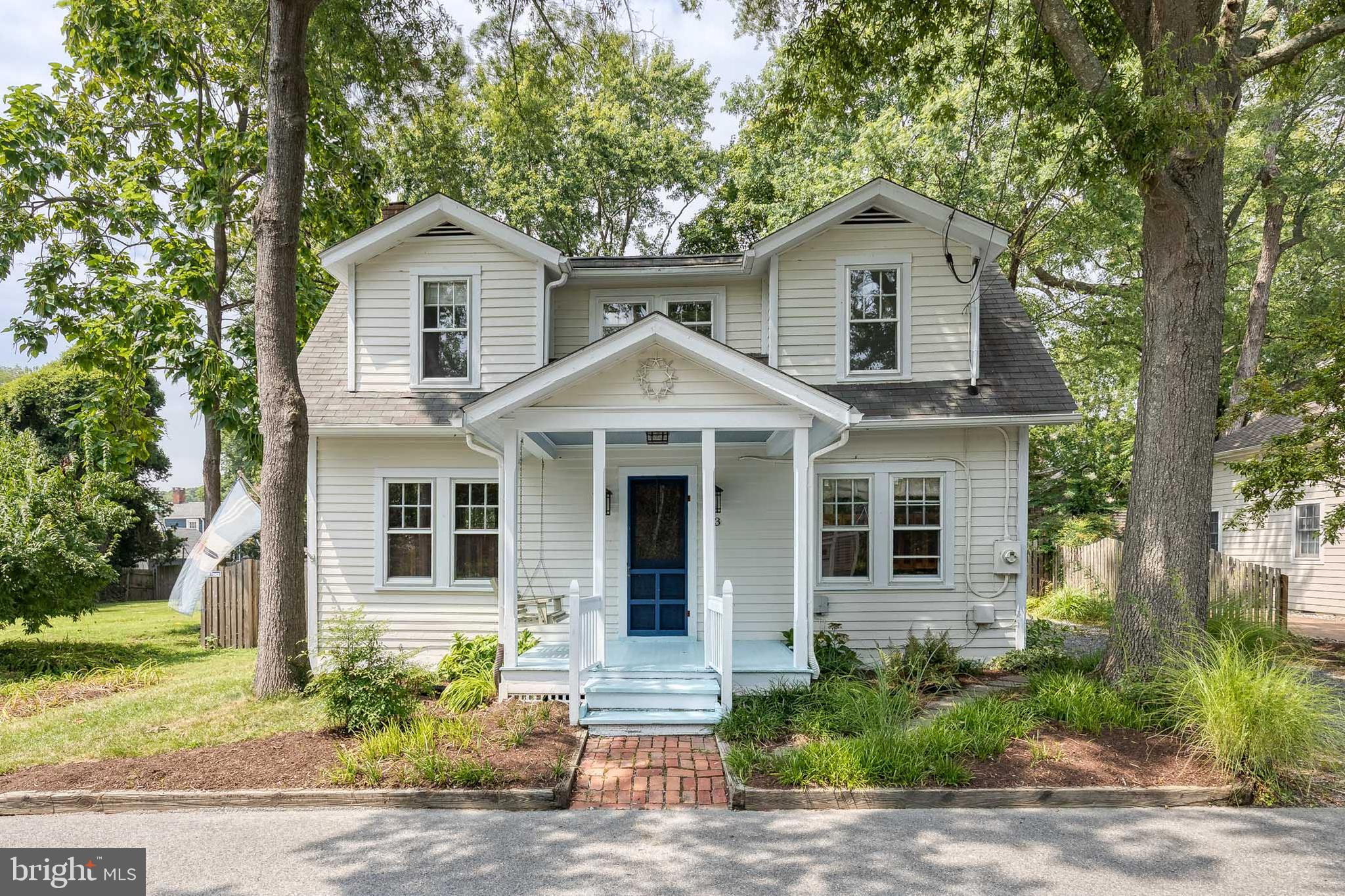 Nestled in the heart of the St. Michaels Historic District, this charming 3-bedroom, 2-bath home is a designated historic landmark that beautifully blends classic character with modern convenience.
Step inside to find refinished original wood floors (2021), stunning historic details like a pocket door between the hallway and living room, coffered ceiling and back staircase up to the primary bedroom. Updated for modern preferences, it offers a spacious layout with both comfort and functionality.
The upper-level hall bathroom features a massive walk-in closet, providing ample storage.
Enjoy cooking and entertaining in the expansive kitchen with island and room for a full dining table, stainless steel appliances, and new stove and refrigerator (2022).
Step outside to your fully fenced backyard retreat complete with a screened-in porch, outdoor shower, and two sheds, one of which is insulated and has electric, perfect for a workshop or hobby space.
Modern updates include new A/C mini-split system (2023) for year-round comfort. A unique opportunity to own a piece of history in one of Maryland’s most picturesque towns!