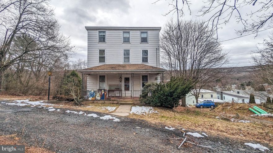 This 4/5 bedroom detached home in Middleport, Pa., presents a great opportunity for investors or fixer-upper enthusiasts. Nestled on a private road, property is ready for new owner to bring to life with love and updates. With spacious layout, home offers the potential for customization and transformation into a dream residence. Step into comfort on the first floor, where a cozy living room welcomes you. Adjacent is versatile space that can be used as den or an additional bedroom. The spacious eat-in kitchen holds great potential for becoming a chef's dream, and it opens up to a large deck, providing a perfect spot for relaxation. On the first floor, you'll also find full bathroom and convenient laundry closet equipped with dryer. Moving to the second floor, discover four nicely sized bedrooms, two of which are connected, offering flexibility in their use. Full walk-out basement ensures ample storage space for your needs. Outside, the property boasts a detached garage and a covered front porch, adding to its charm. Situated on a generous 1.02-acre lot, this home provides both indoor and outdoor spaces for you to make your own. Home has fruit trees on property, including apple, pears, cherry and blueberry bushes. Located on private road. With a bit of imagination and effort, this property can transform into a delightful residence. Centrally located between Pottsville and Tamaqua, and Locust Lake State Park and Tuscarora State Park are both only 15 minute drive away. Sold as is.
