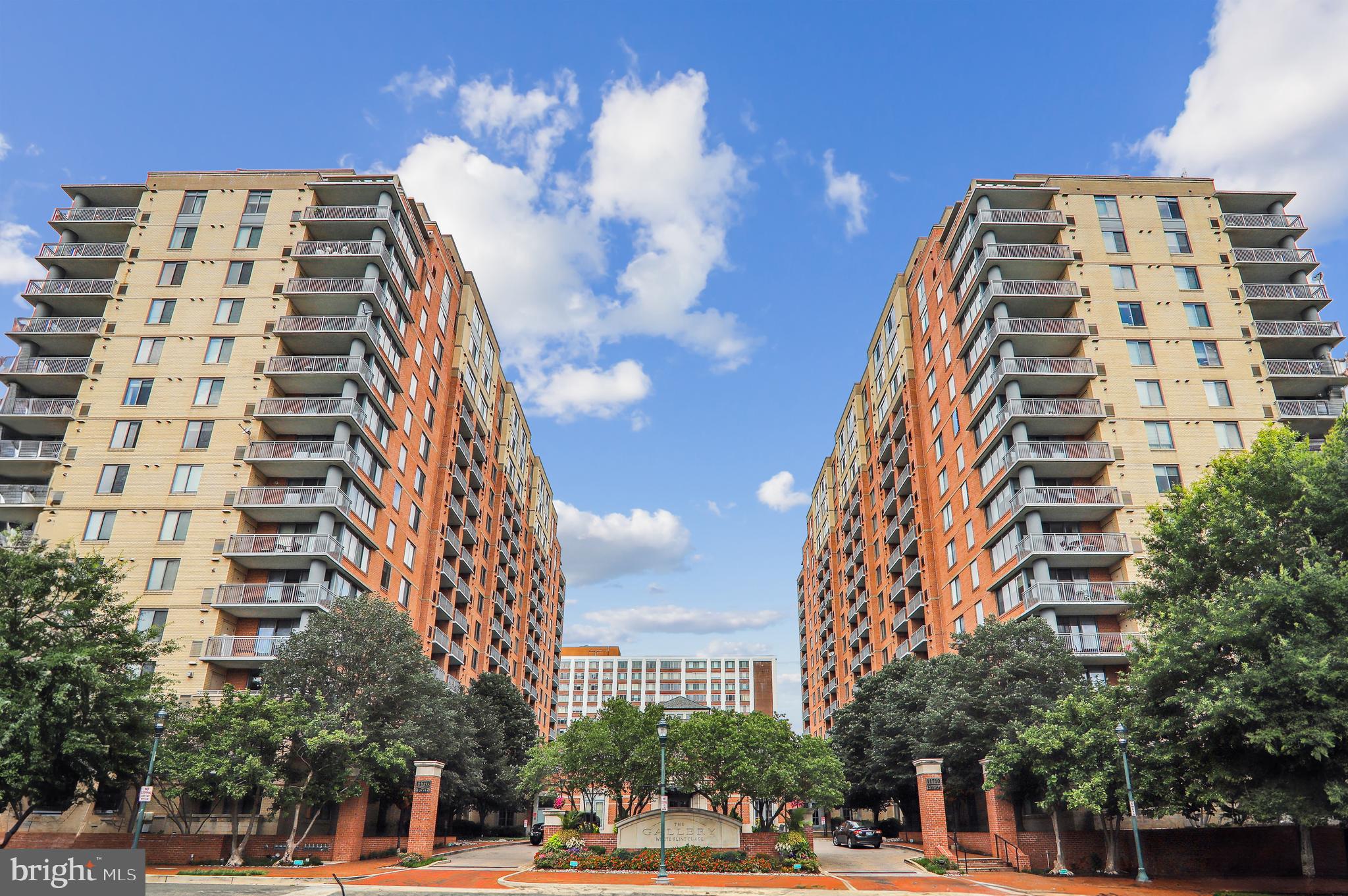 Welcome to this tastefully updated one bedroom, one bath luxury condominium. This open floorplan boasts wood-look LVP flooring, high ceilings and custom moldings throughout. There is a welcoming foyer, generous sized kitchen with maple cabinets, granite counters & Maytag stainless steel appliances and a spacious living room/dining room combination. The large bedroom features a walk-in closet, wall closet with mirrored doors and door to the dual entry ceramic tile full bath with white vanity and tub/shower. This well cared for apartment is in pristine condition and ready to move right in. Seller has added upgrades that include stackable washer & dryer in the laundry closet, kitchen and bath faucets, garbage disposal, microwave, 2-inch blinds, gas hot water heater, paint and much more. Filled with natural light from the large windows you also have a view of the courtyard and pool from this 15th floor unit. Garage parking space (#301) is included. Pet friendly community. The Gallery is an amenity-rich building, featuring an inviting community lounge/party room with fireplace and bar, billiard room, well equipped gym, manicured courtyard, and wonderful pool. This incredible location provides you with easy access to restaurants, shops, entertainment venues at Pike & Rose and 1 block from Metro. What more could you ask!