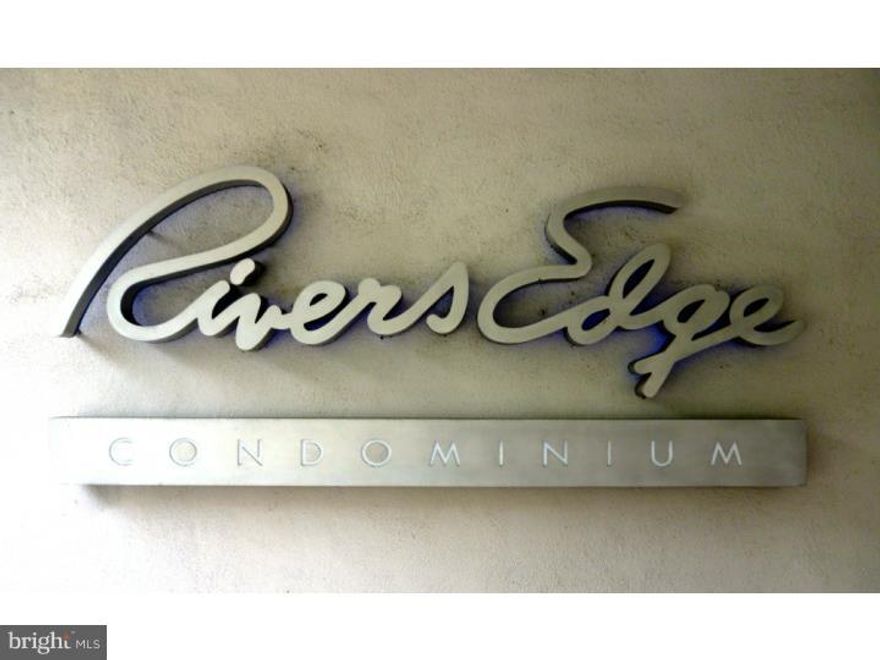 Welcome to a sophisticated tri-level, light-filled end unit condominium at Rivers Edge. A spacious 2 bedrm, plus den & 3 full baths with new, custom Italian Alfa Lum windows on 3 sides and views of the city, the meandering river & the Schuylkill River Trail. Take the elevator up to 9/10 floor & walk down a hallway which is filled with light from the newly installed windows. Enter the unit through the den/study, complete with a full bath & stacked laundry units & a large closet. Steps down to next level with large eat-in kitchen with lots of storage, granite counters & mirrored  backsplash. Angled rooms allow interesting flow from kitchen to dining room & living room. Large patio with beautiful views. Third level leads to Master bedroom with generous closets, lots of light, full bath w/tub & stall shower. Large walk-in storage closet & linen closet in hall. Second bedroom & 3rd full bath complete this level. Hardwood floors thru-out, quiet & efficient zoned heat & air, 2 ceiling fans, deeded inside parking in upper garage, 24 hr doorman, community roof deck; Close to Schuylkill River Trail for walking, biking or jogging, 30th St station, Trader Joe's, Whole Foods, UPenn, Drexel, Philadelphia Museum of Art, Barnes Foundation, Rodin Museum, The Parkway, Boat House Row & Logan Circle. Take a tour soon & make this beautiful condo your new home!