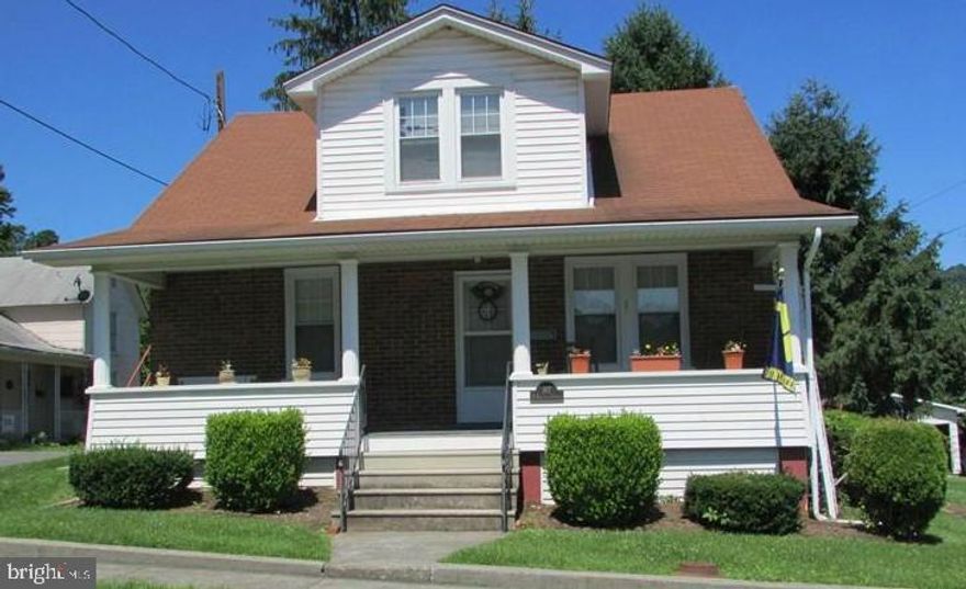 Priced to sell!!  Convenient location.  Live in one aprartment and rent the other, or could easily convert back into single family living space. Well maintained brick home (upper/lower apartments)  situated on a generous corner lot. Conveniently located just off Route 50 in Romney. Walk to Dairy Queen, convenience stores, hospital and more.  Just a few minutes from Must see to appreciate. Live in one and rent the other, or rent them both to maximize return on your investment. Could easily be concerted back to single family usage. Call today!