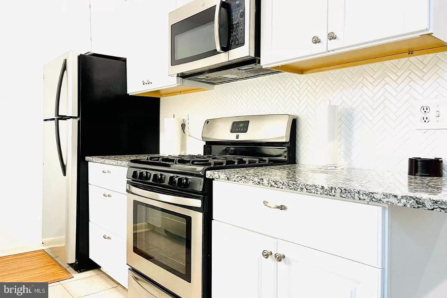 We are pleased to offer this completely renovated 2 bedroom, 2 bathroom condo.  Gas for cooking & heat, and water and included in the condo fee. You are only responsible for electiricty and cable/wifi. Located in the Fairwinds community. This unit has been freshly painted in a cool, clean and calming grey/blue color. The floors have also been updated in grey driftwood inspired wood-like laminate flooring, great for easy cleanup and offers the unit an upscale and sophisticated feel. Located on the top floor, this unit boasts a great outdoor balcony overlooking a quiet walking path. The kitchen has been updated with on-trend white, craftsman style cabinets. The new granite counters provide ease of cleanup, function, and style; the appliances are stainless steel, and the stove is gas for gourmet cooking. The high-end drop-in sink sets the kitchen apart from other units in the community. The spacious dining room, right off the kitchen provides a dedicated area for dinner guests. Both the master and hall bath have new vanities and light fixtures, plus the master bath has an oversized shower stall with sliding glass doors. The master bedroom will easily accommodate a king-size bed, with space for seating. The large walk-in closet, wall closet, and vanity niche makes getting ready a breeze. The second bedroom is also generous in size allowing for a queen-size bed. It has a large, long wall closet that will accommodate an impressive amount of clothing storage. A full size washer and dryer hidden behind folding doors offers convenience and additional storage. A full size linen closet plus coat closet gives tons of storage space. For those who work from home, there is a designated space in the unit to set up a home office. For those who commute to work this location is ideal to get to Annapolis, DC, Baltimore or Fort Meade. In addition, BWI airport is easily accessible as well. For those who enjoy parks and nature, you are minutes away from Quiet Waters Park. The amenities don't end there! You have ample parking, and use of the community pool, tennis courts, kayak, bike, and moped storage.