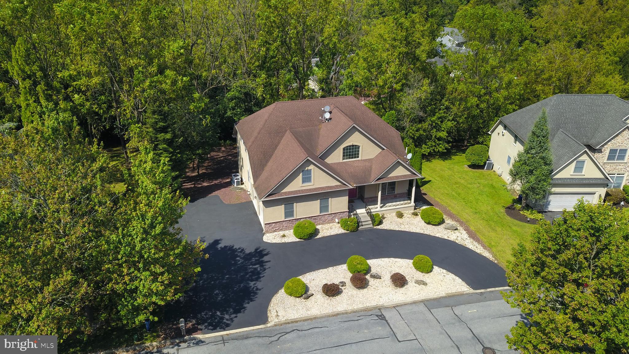 Elegant living meets Entertaining & Convenience at this Forks Twp custom-built 5 bedroom 4.5 bath home by Oieni Construction. Inside, soaring ceilings, crystal chandeliers, & freshly painted main-level create a bright, sophisticated space. Wood and granite floors flow throughout expansive rooms filled with natural light. Dramatic 2-story great room w/ gas fireplace opens seamlessly to the dining room & gourmet kitchen w/ stainless appliances, island seating, granite flooring, and a walk-in pantry. A FIRST FLOOR Primary Suite includes a Walk-in closet & en-suite bath w/ large dual sink, and jetted tub, and 1st floor office & laundry. Upstairs features a SECOND Guest en-suite and large spacious bedrooms w/ a walk-in closets. The FULLY FINISHED Walk-out Lower Level is built for entertaining, featuring a cherry wood wet bar/kitchenette, built-in surround sound system, flexible media / recreation spaces, plus bonus room & FULL bathroom, perfect for guests or exercise room. Nestled on a picturesque 0.4 acre lot, enjoy the outdoors from the trex deck, gazebo and covered patio offering a peaceful retreat with minimal upkeep. With a circular driveway, mature trees and set in a quiet neighborhood w/ an easy commute to NJ/RT 22, 33, 78 & the convenience of nearby shopping, parks, & downtown Easton upscale dining. This home blends elegance, comfort & convenience in one exceptional address. Ask how to receive a $4,000 lender credit towards closing costs or lowering your interest rate!